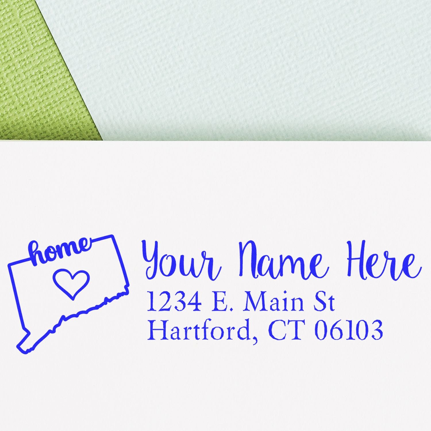 Slim Pre-Inked Connecticut State Love Custom Address Stamp on white paper, featuring a blue outline of Connecticut with home text and heart, alongside a sample address in elegant blue font.