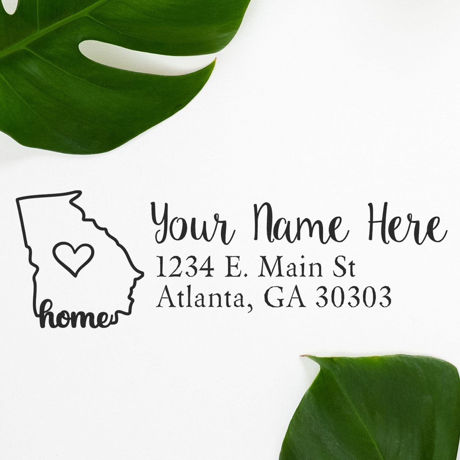 PSI Pre-Inked Personalized Georgia State Love Address Stamp on white paper with green leaves, featuring a heart inside Georgia outline and customizable address text.