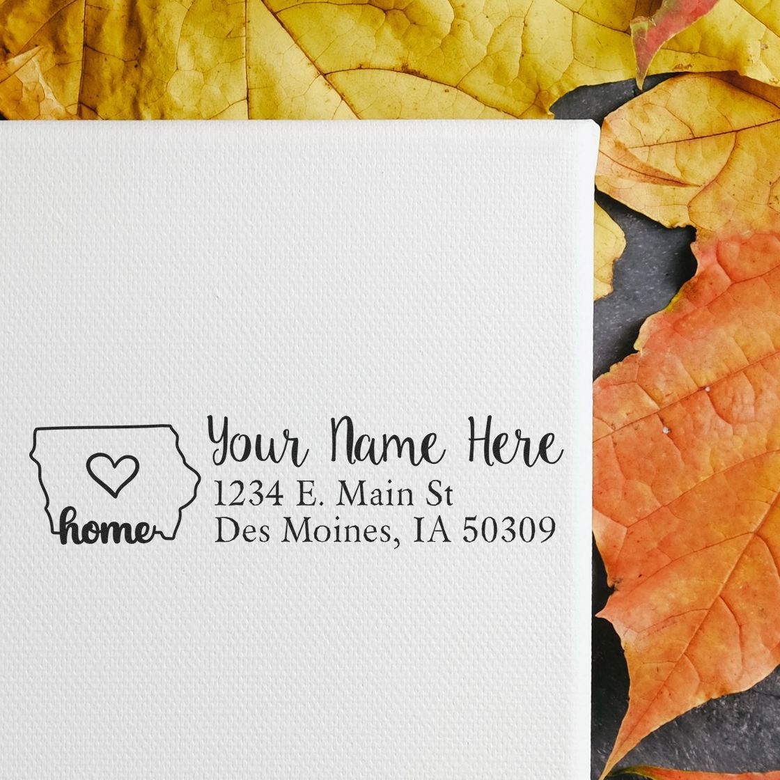 PSI Pre-Inked Personalized Iowa State Love Address Stamp on white paper, featuring a heart in Iowa outline, surrounded by autumn leaves.