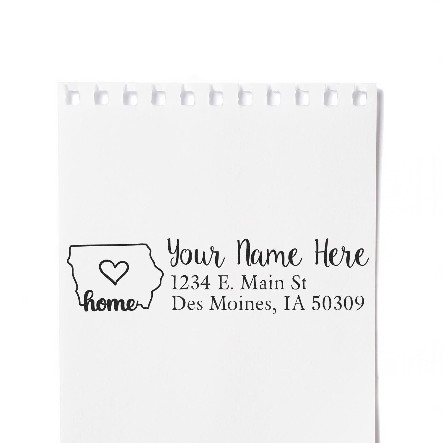 Wood Handle Iowa Custom Address Rubber Stamp on white paper, featuring a heart inside the state outline and sample text: Your Name Here, 1234 E. Main St, Des Moines, IA 50309.