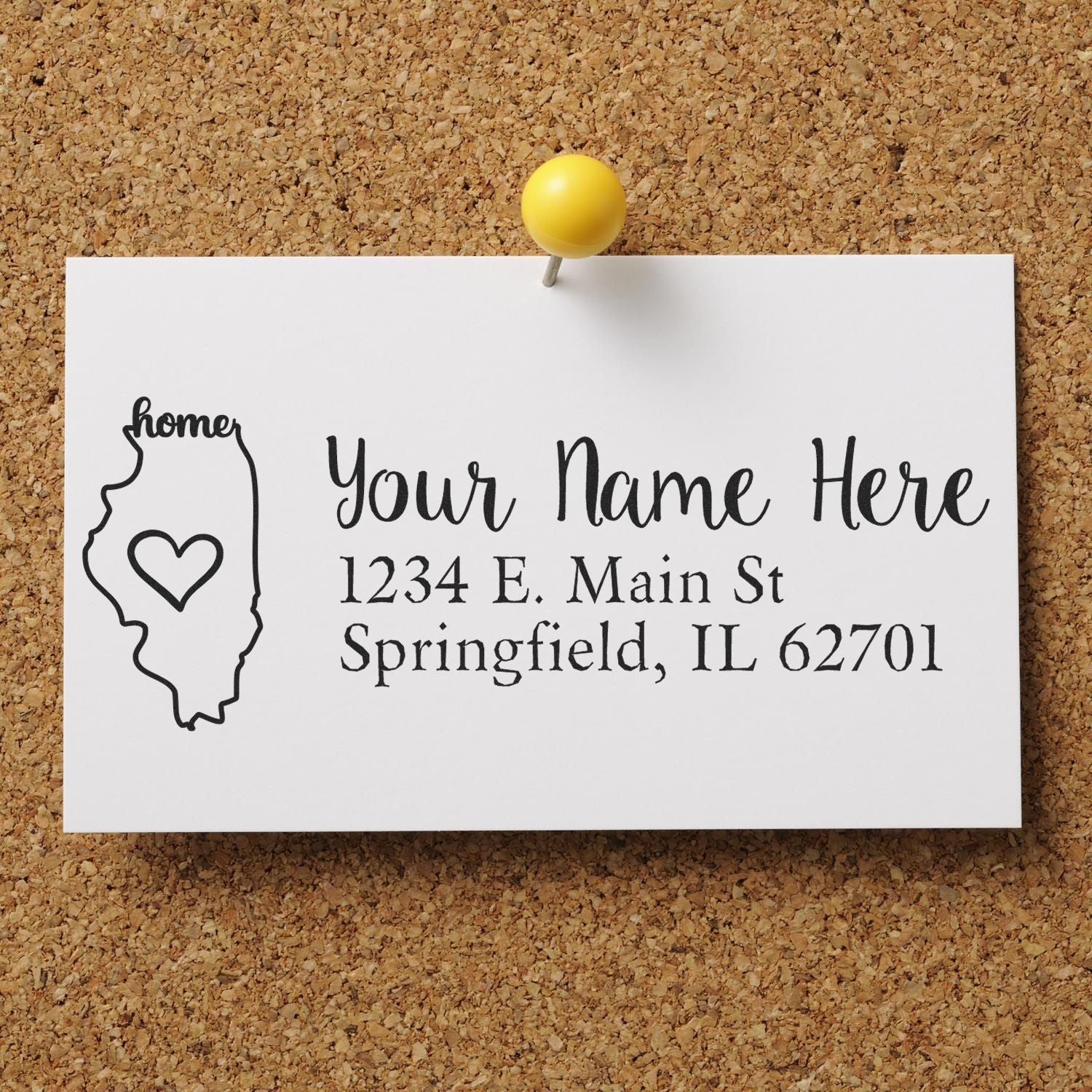 Illinois Self-Inking State Love Address Stamp on a corkboard, featuring a heart within the state outline and customizable address text.