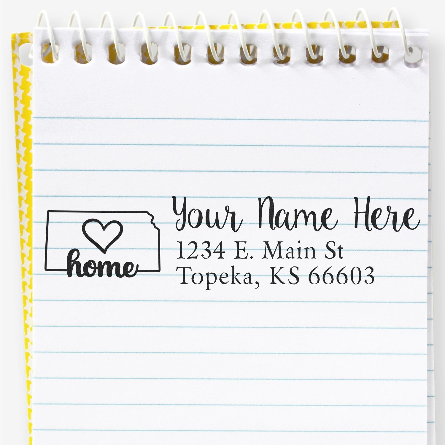 PSI Pre-Inked Personalized Kansas State Love Address Stamp on a notepad, featuring a heart design and sample address: 1234 E. Main St, Topeka, KS 66603.