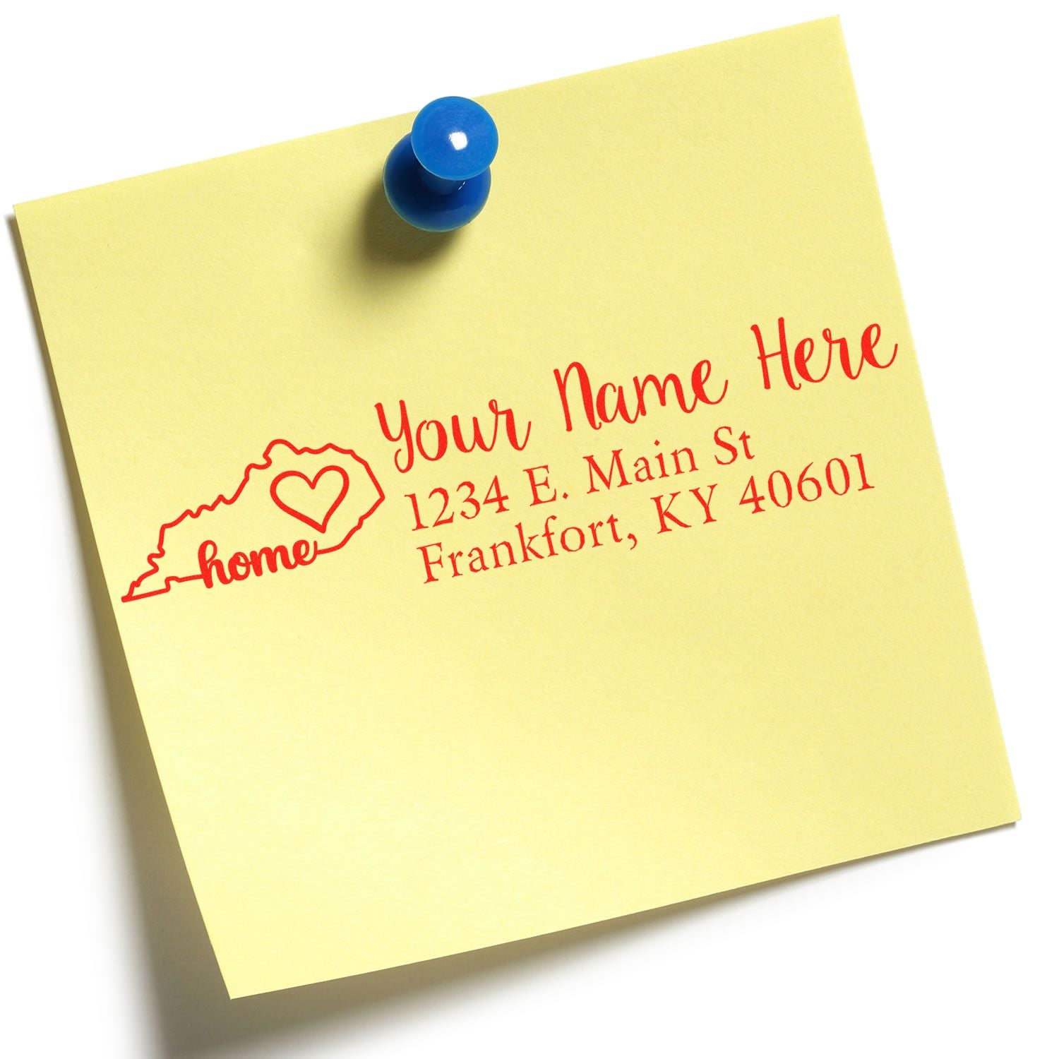 Yellow sticky note with red text showing a custom address design featuring a heart and Kentucky outline. The Wood Handle Kentucky Custom Address Rubber Stamp is pinned with a blue pushpin.