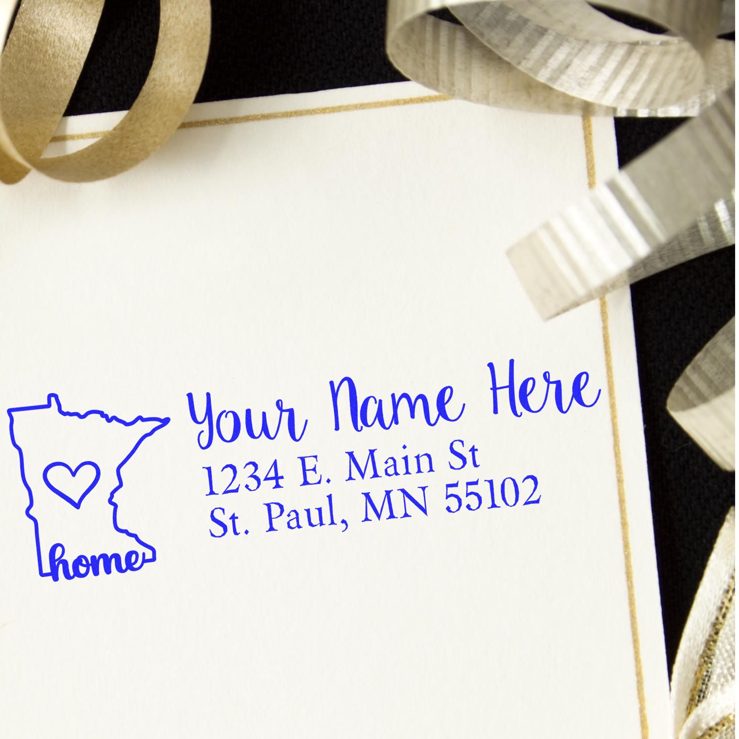 PSI Pre-Inked Personalized Minnesota State Love Address Stamp on a card with gold ribbons, featuring a blue outline of Minnesota, a heart, and customizable text for name and address.