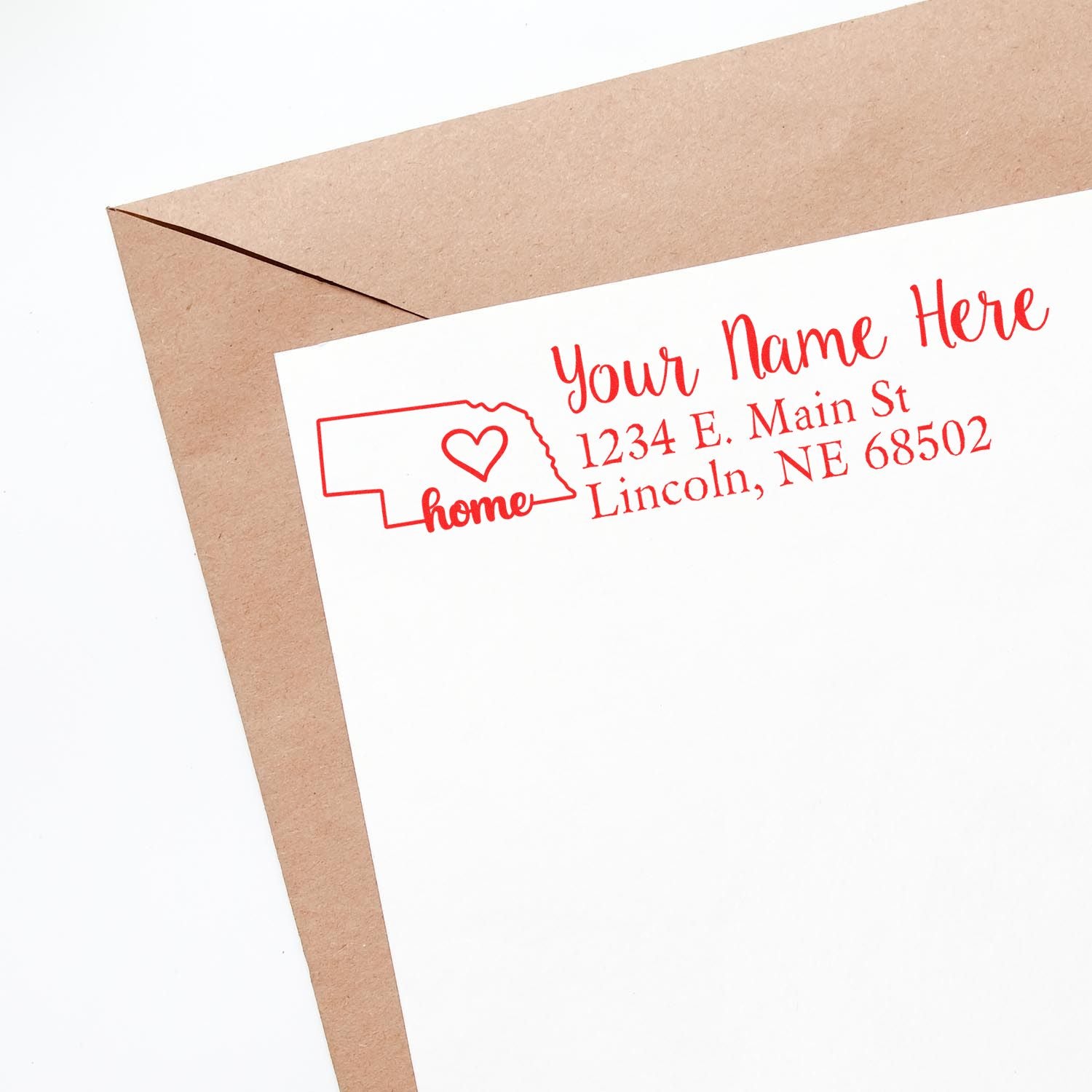 Envelope with a Nebraska Self-Inking State Love Address Stamp featuring a red outline of Nebraska, a heart, and customizable address text.