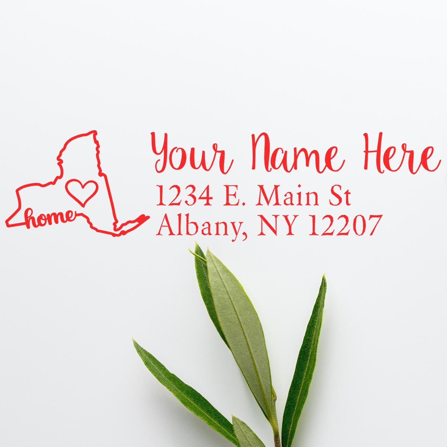 New York Self-Inking State Love Address Stamp in red ink, featuring a heart within the state outline and customizable address text. Green leaves accent the design on a white background.