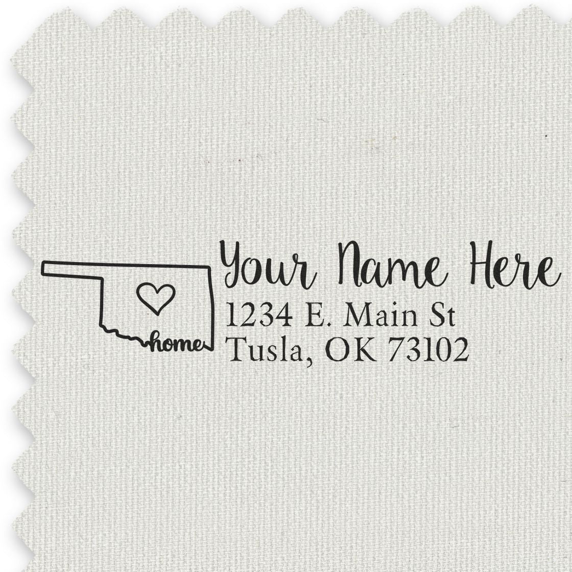 Wood Handle Oklahoma Custom Address Rubber Stamp on fabric, featuring a heart inside the state outline with home text, personalized with name and address: 1234 E. Main St, Tulsa, OK 73102.