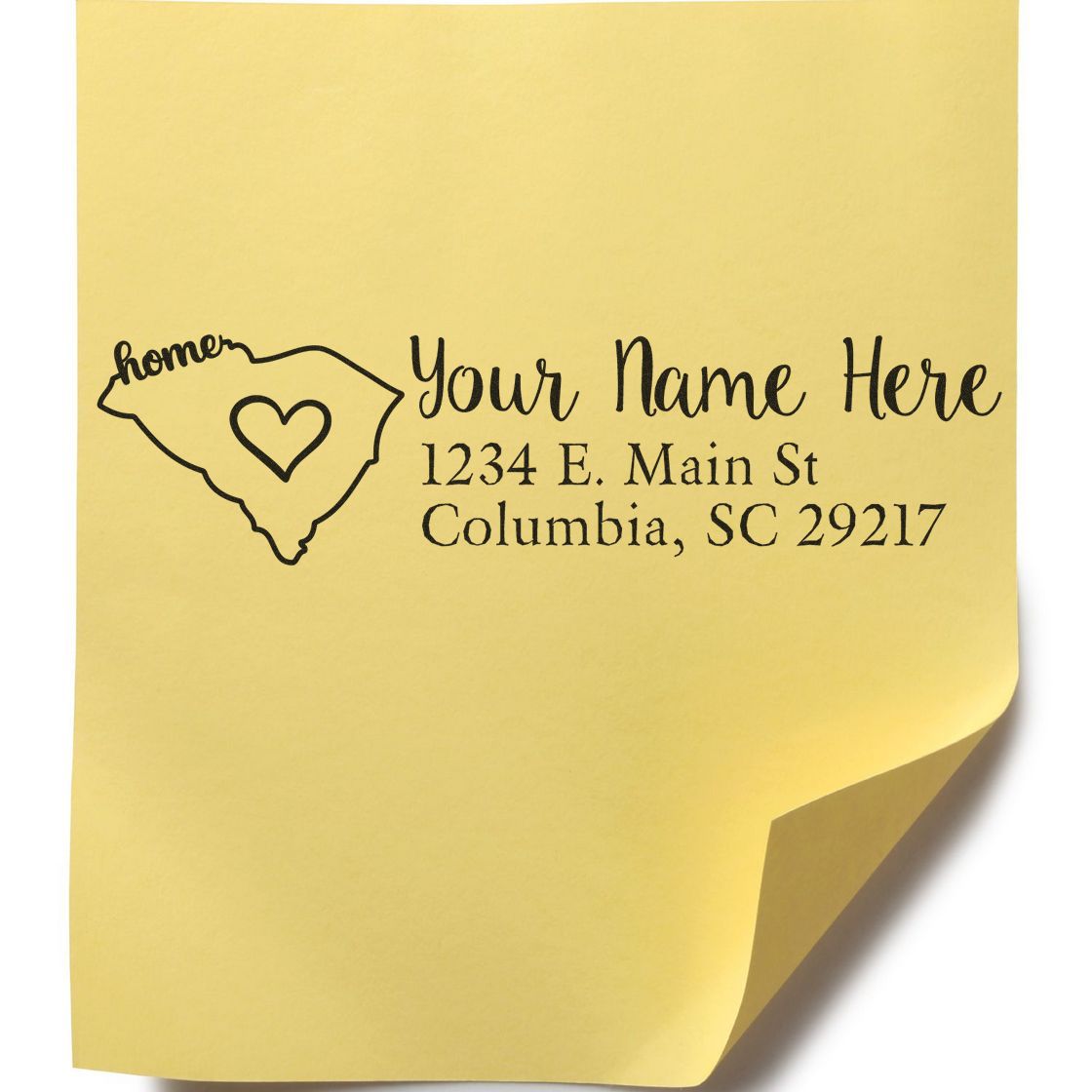 Yellow sticky note with a stamped design featuring the outline of South Carolina, a heart, and customizable text. The Slim Pre-Inked South Carolina State Love Custom Address Stamp is shown in use.