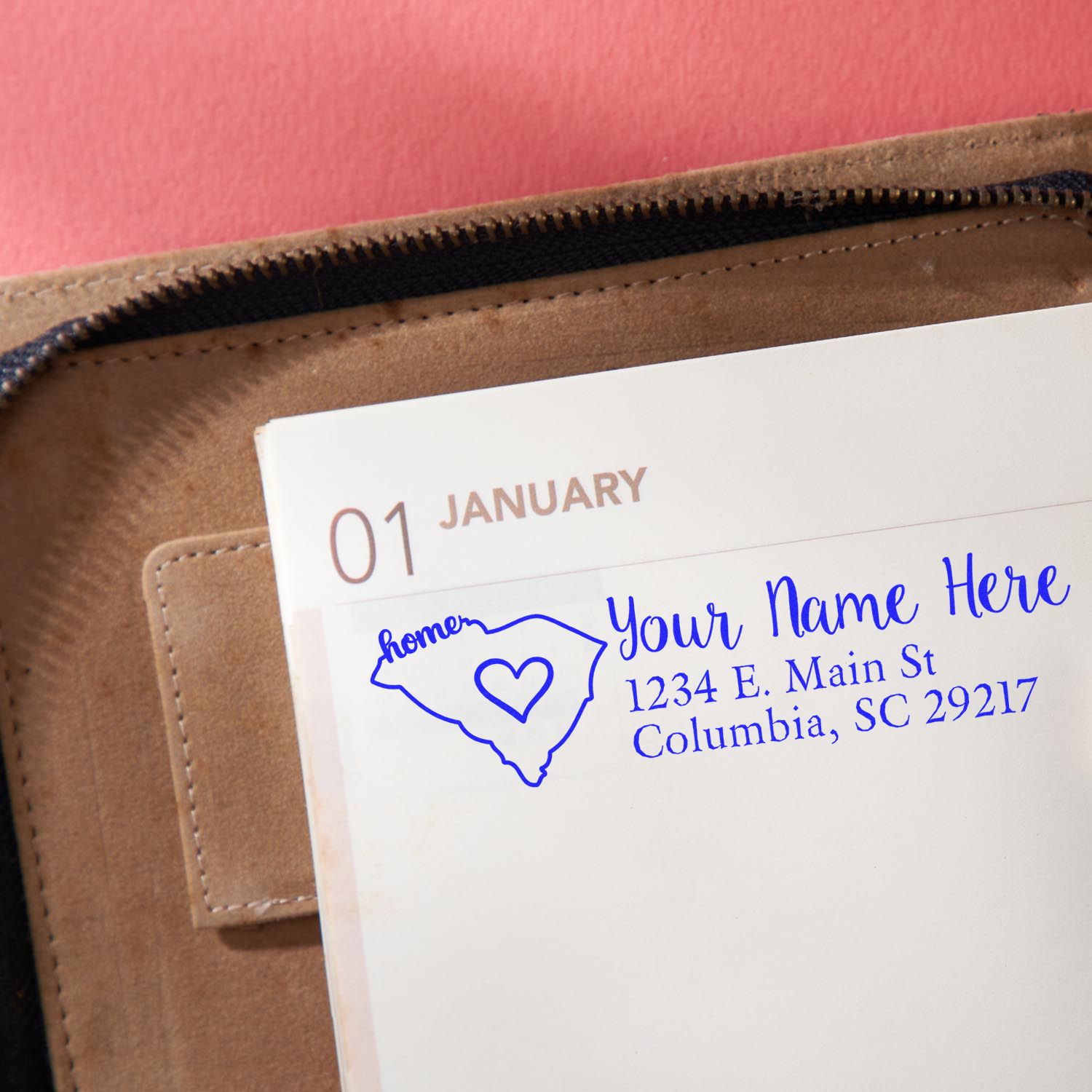 Slim Pre-Inked South Carolina State Love Custom Address Stamp on a planner page, featuring a heart design and personalized address in blue ink.