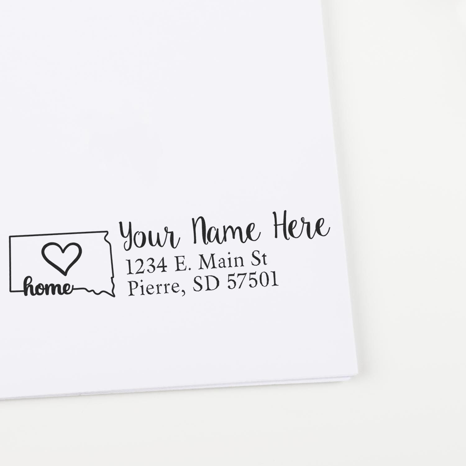 Wood Handle South Dakota Custom Address Rubber Stamp imprint on white paper, featuring a heart inside the state outline and personalized address text.