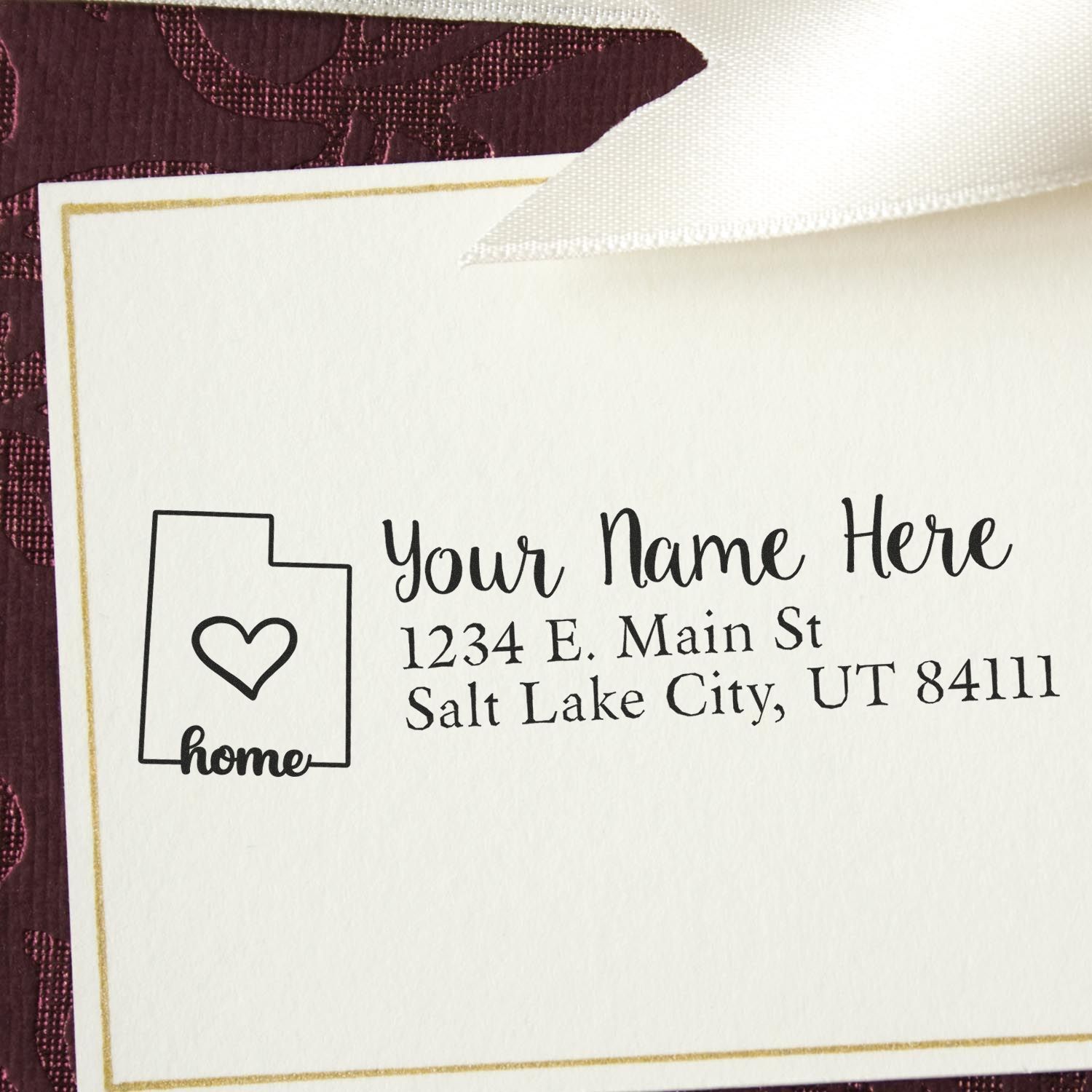 Wood Handle Utah Custom Address Rubber Stamp on a card with a heart and home design, featuring placeholder text for name and address in Salt Lake City, UT. Elegant and personalized stationery accessory.