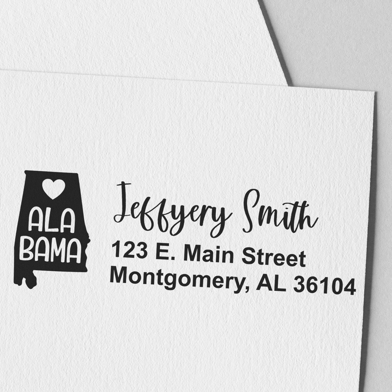 State Love of Alabama Custom Address Stamp Self-Inking on white paper, featuring a heart and Alabama state outline with personalized address in elegant script and bold font.