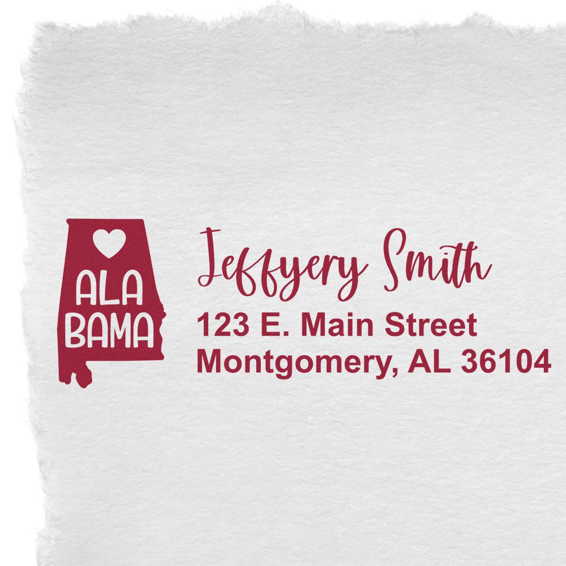 Alabama State Love Personalized Address Stamp featuring a red Alabama outline with a heart, personalized with Jeffery Smith, 123 E. Main Street, Montgomery, AL 36104 on white paper.