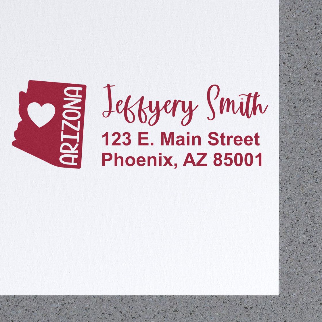 Arizona State Love Personalized Address Stamp featuring a heart and state outline, with red text displaying Jeffery Smith, 123 E. Main Street, Phoenix, AZ 85001 on a white background.