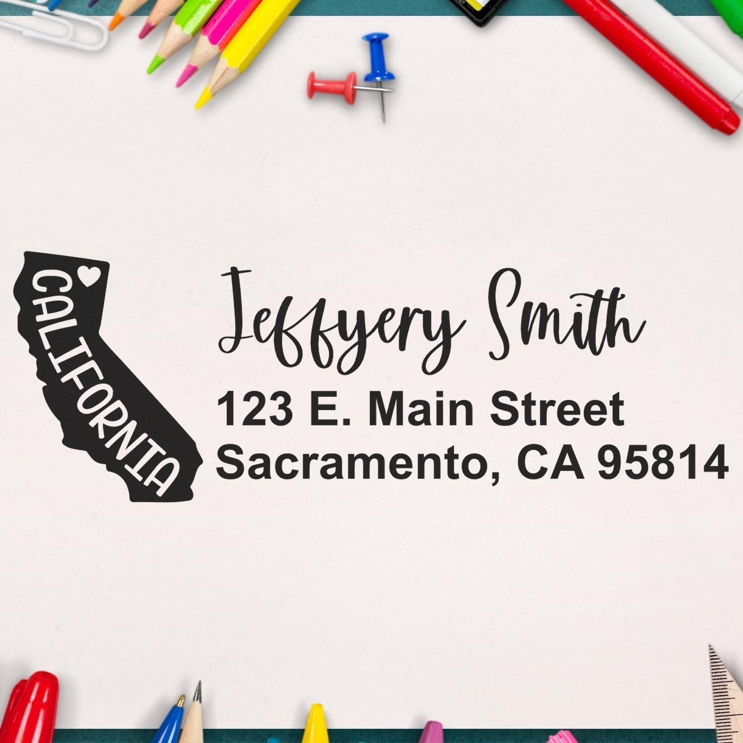 California State Love Personalized Address Stamp on paper with colorful stationery, featuring a heart design and address: Jeffery Smith, 123 E. Main Street, Sacramento, CA 95814.