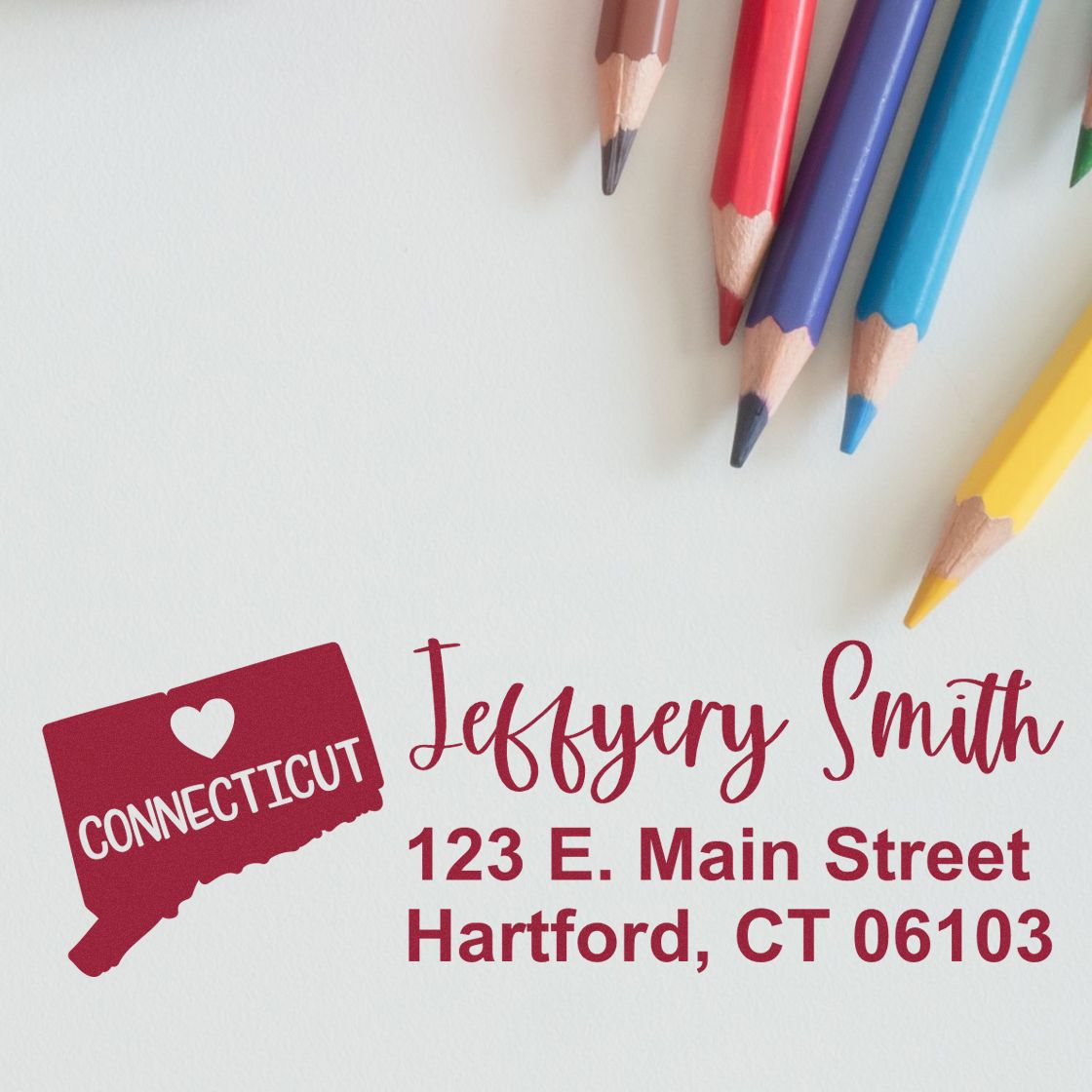 Connecticut State Love Personalized Address Stamp on paper with colored pencils. Displays 'Connecticut' map, heart, and sample address: 123 E. Main Street, Hartford, CT 06103.