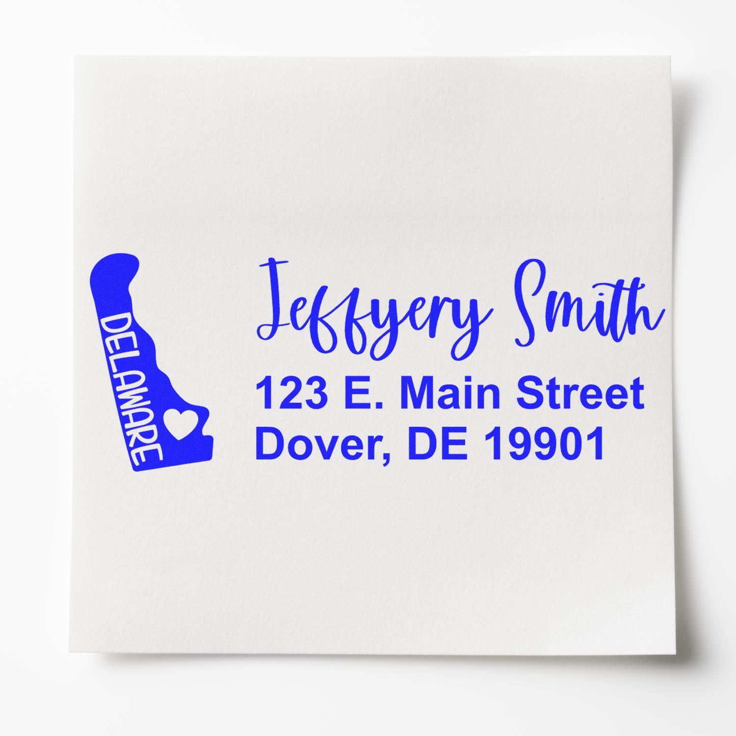 State Love of Delaware Custom Address Stamp Self-Inking displayed on paper, featuring a blue Delaware state outline with heart and personalized address in elegant script.