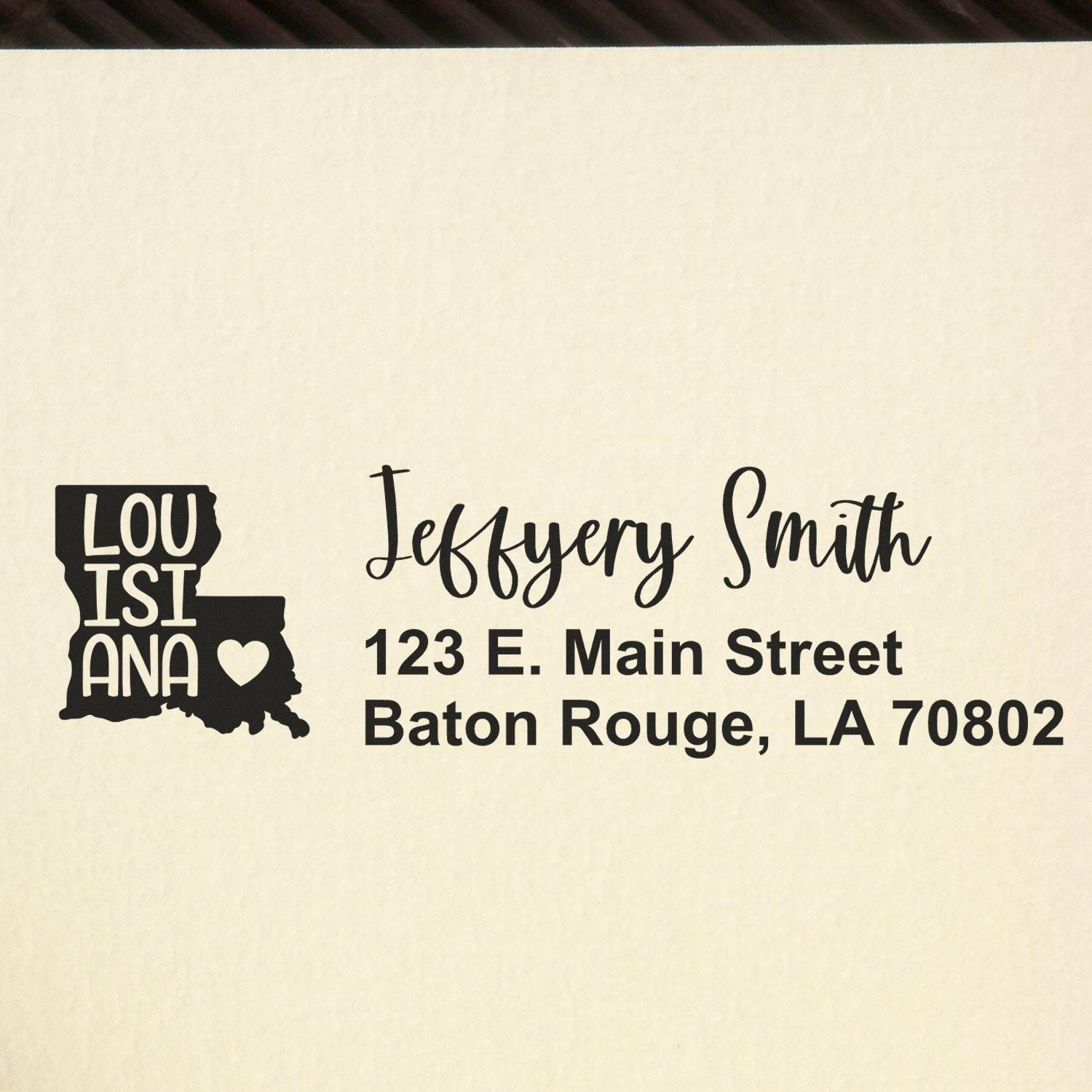 Louisiana State Love Personalized Address Stamp featuring a heart design and custom text for Jeffery Smith, 123 E. Main Street, Baton Rouge, LA 70802 on a beige background.