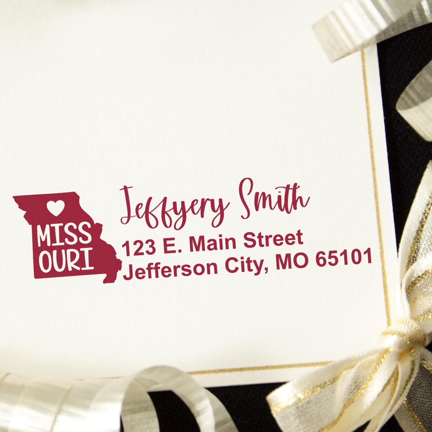 PSI Pre-Inked Missouri State Love Customized Address Stamp on a white envelope with gold ribbon, featuring a red Missouri state outline and personalized address in elegant script.