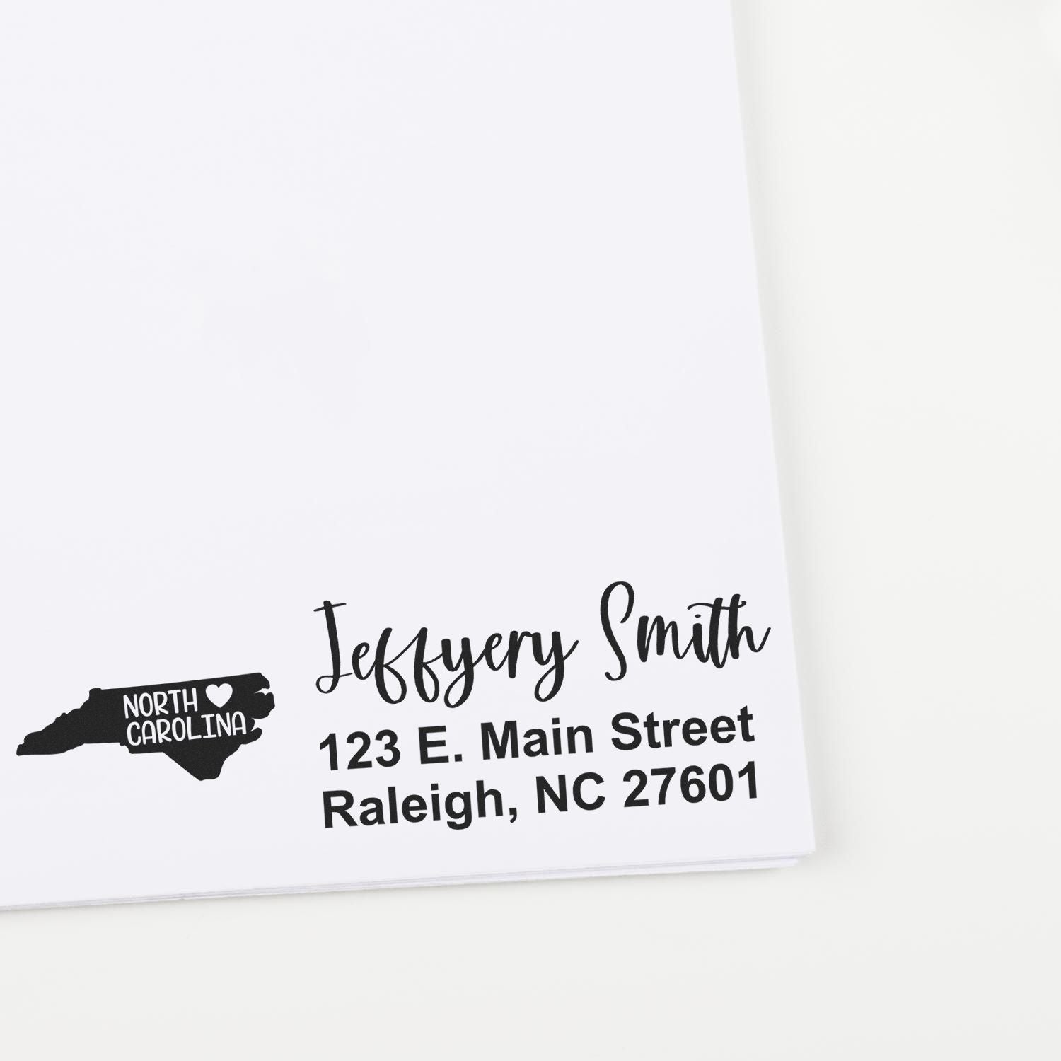 State Love of North Carolina Custom Address Stamp Self-Inking displayed on white paper, featuring a map outline with a heart and personalized address in elegant black font.