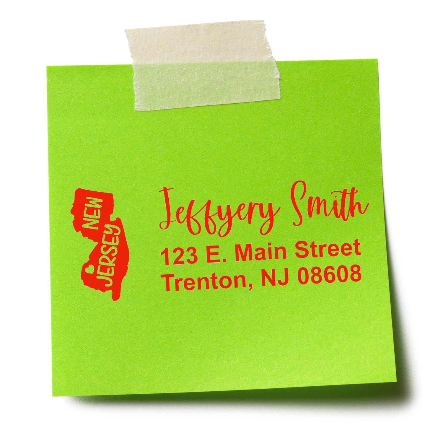 State Love of New Jersey Custom Address Stamp Self-Inking on a green sticky note with red text showing a sample address: Jeffery Smith, 123 E. Main Street, Trenton, NJ 08608, next to a New Jersey outline.