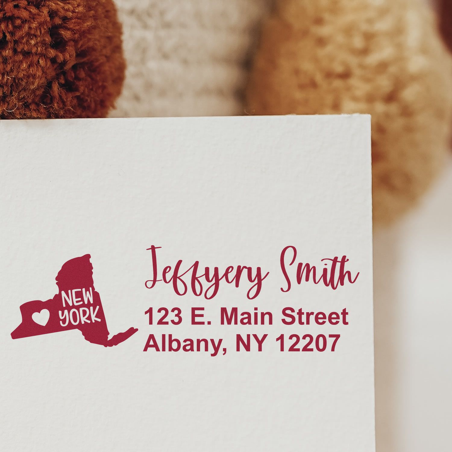 Envelope stamped with 'State Love of New York Custom Address Stamp Self-Inking,' featuring a red New York state outline and personalized address in elegant script.