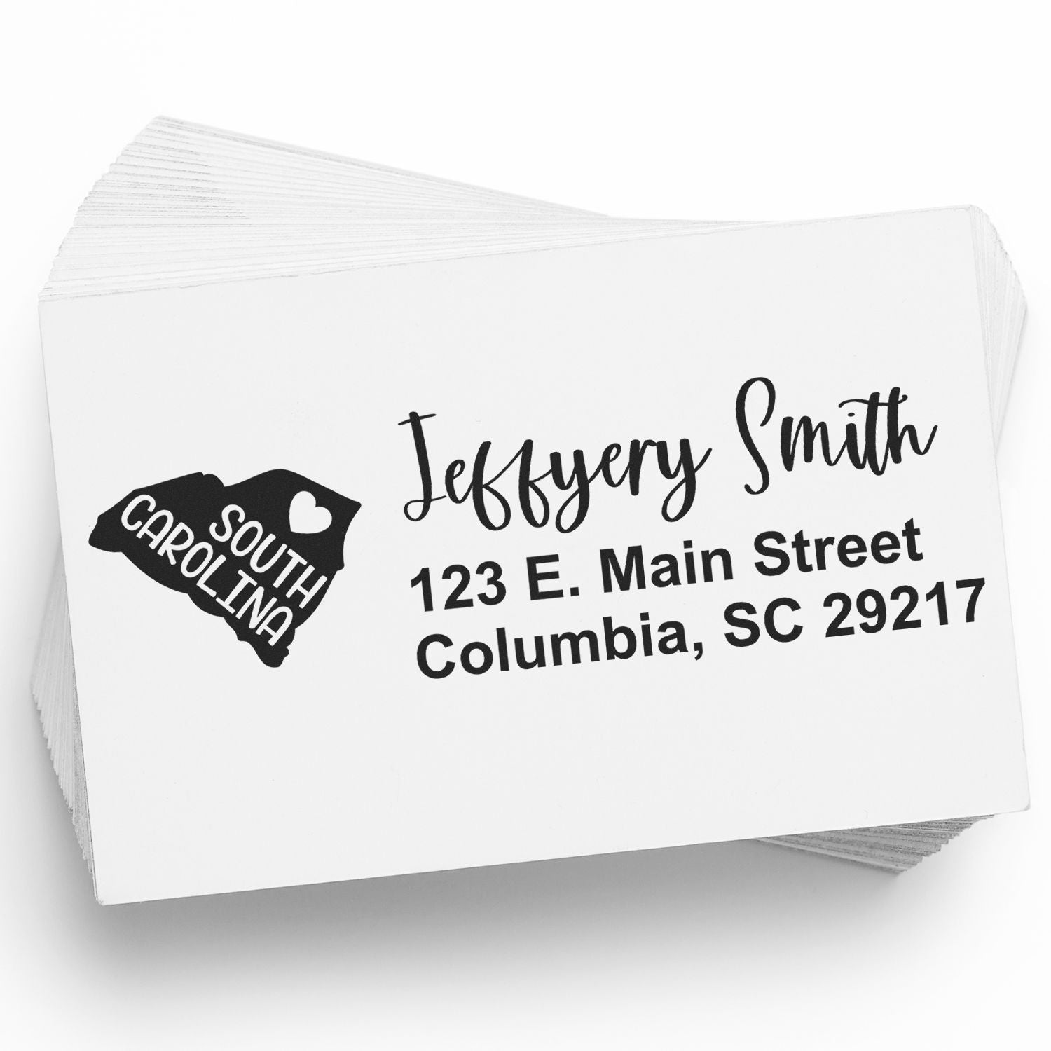 State Love of South Carolina Custom Address Stamp Self-Inking on a stack of envelopes, featuring a heart and state outline design with personalized address details.