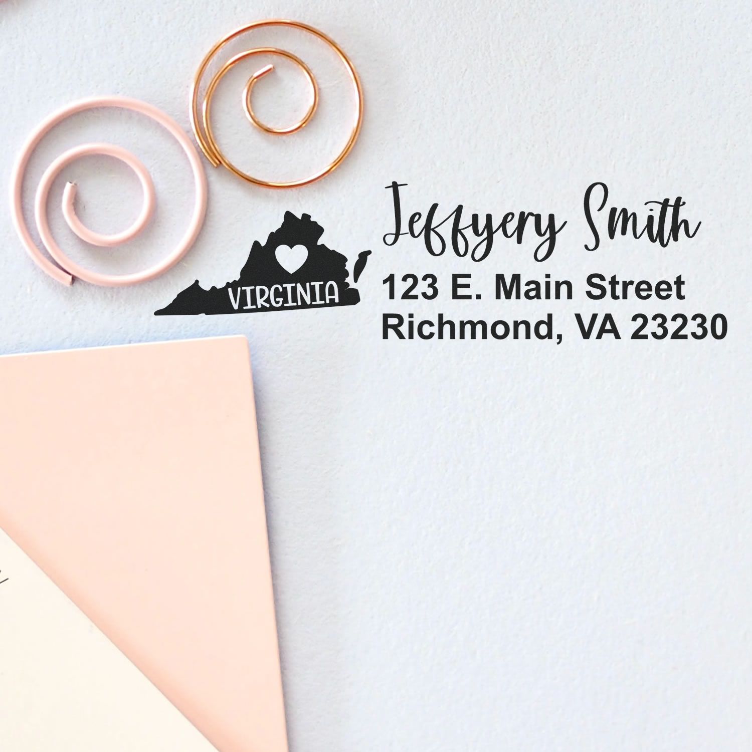 Virginia State Love Personalized Address Stamp on paper, featuring a heart in Virginia's outline, with the name Jeffery Smith and Richmond, VA address. Includes decorative spirals and envelopes.