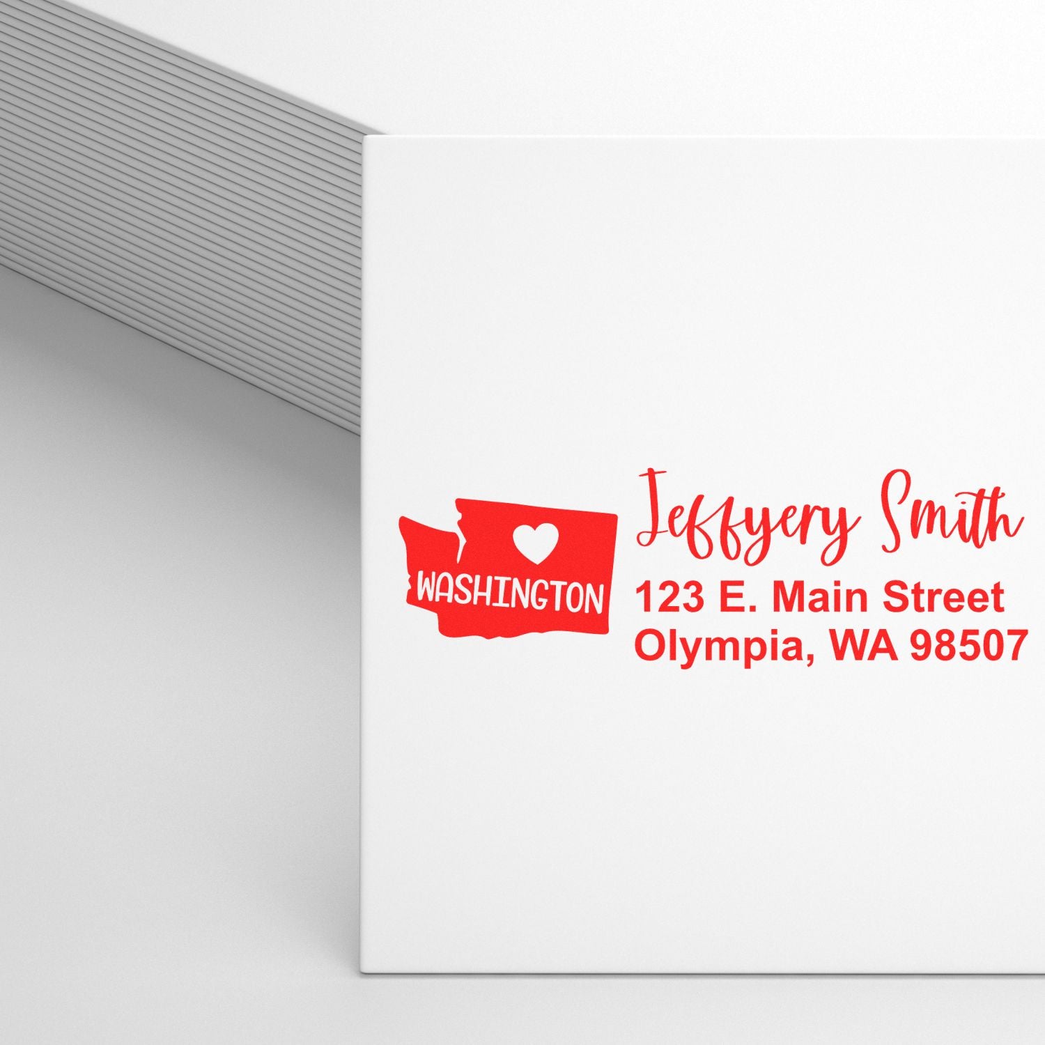 Washington State Love Personalized Address Stamp on white envelope, featuring a red Washington state outline with a heart, and custom address text in red.