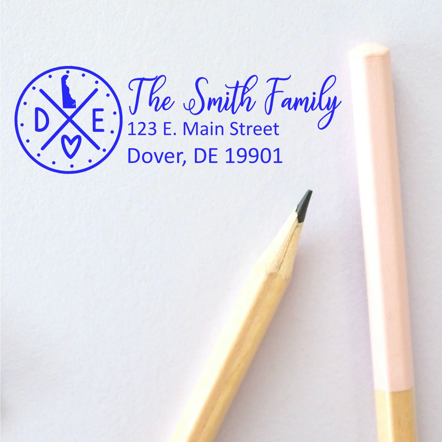 Delaware State Pride Customized Address Stamp featuring The Smith Family with a Delaware outline, address, and decorative elements. Shown next to a pencil and eraser on a white background.