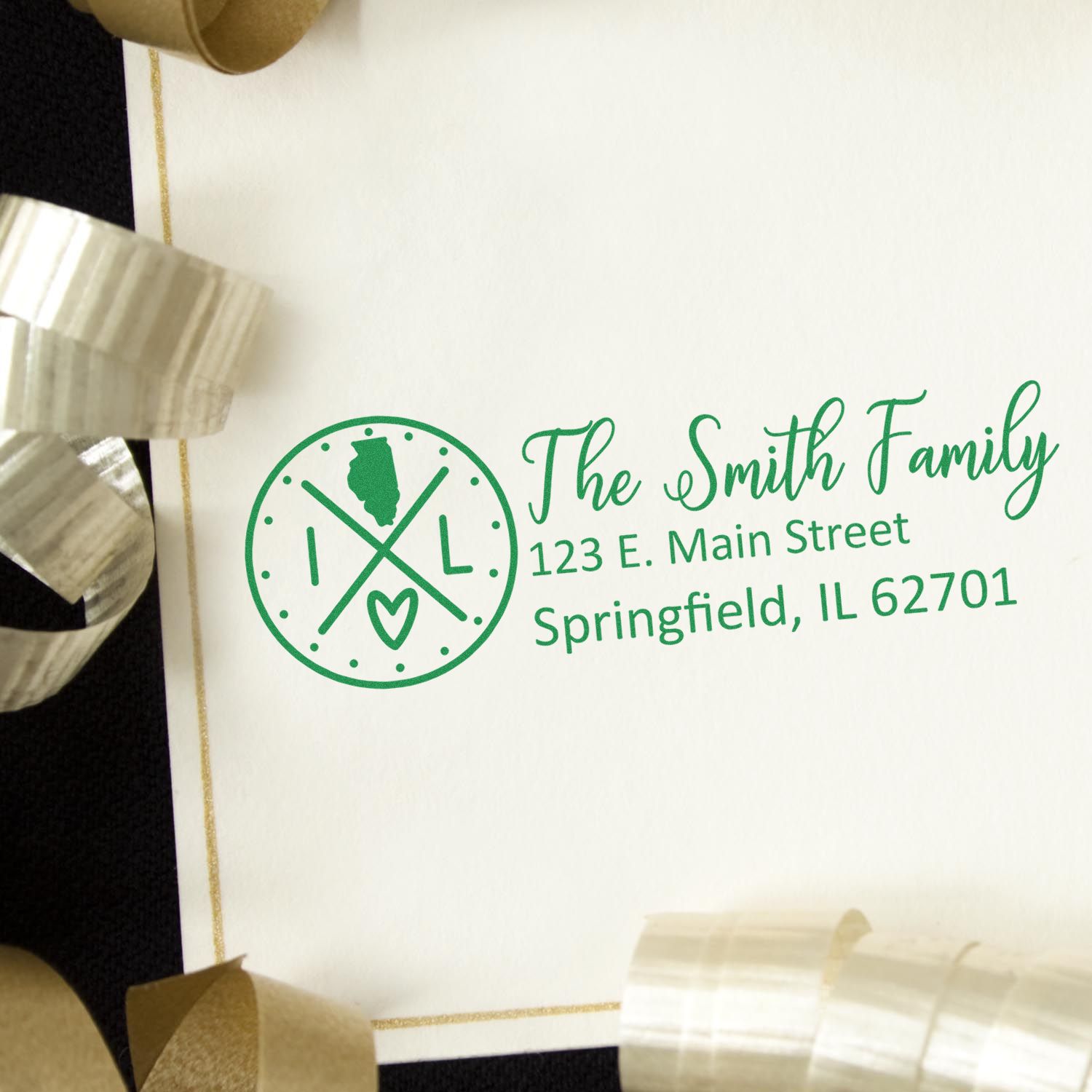 Illinois State Pride Customized Address Stamp on an envelope with gold ribbon. Features a green design with The Smith Family and Springfield address, highlighting Illinois state outline and heart.