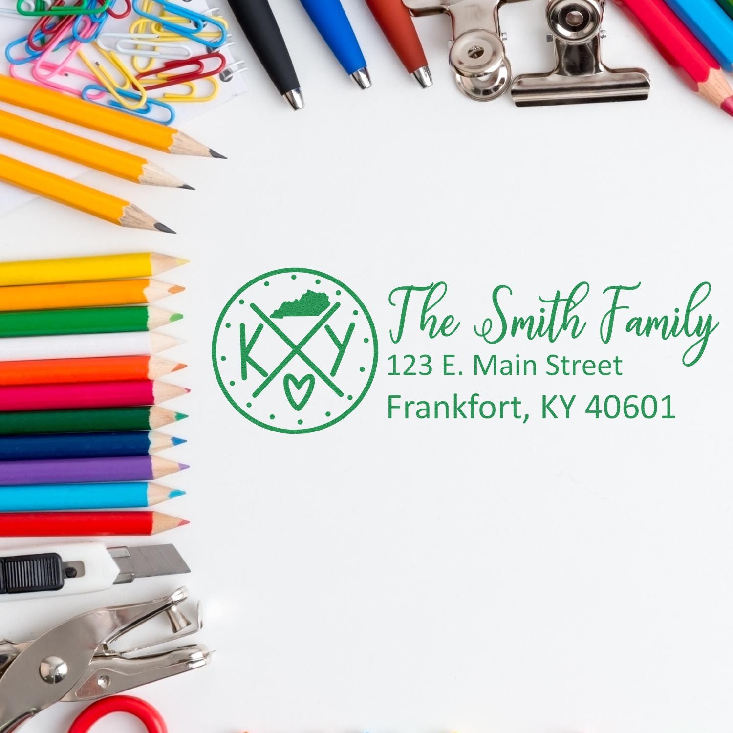 Colorful stationery surrounds a Kentucky State Pride Customized Address Stamp design featuring The Smith Family and an address in green ink, showcasing personalization options.