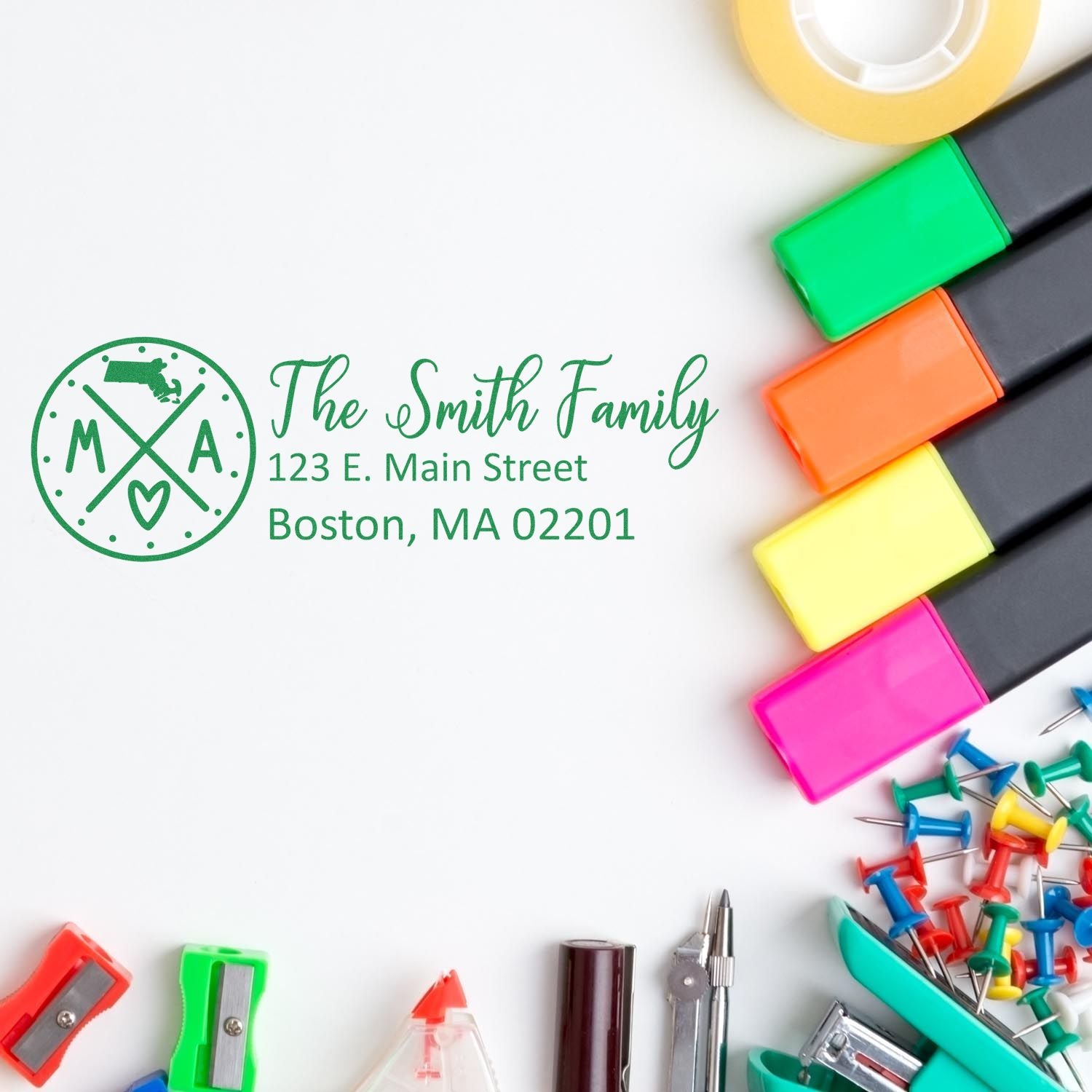 PSI Pre-Inked Massachusetts State Pride Customized Address Stamp featuring The Smith Family with office supplies like markers and push pins on a white background.