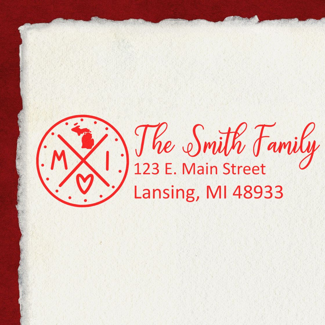 Michigan State Pride Customized Address Stamp featuring a red design with MI and a heart, personalized with The Smith Family, 123 E. Main Street, Lansing, MI 48933 on textured paper.