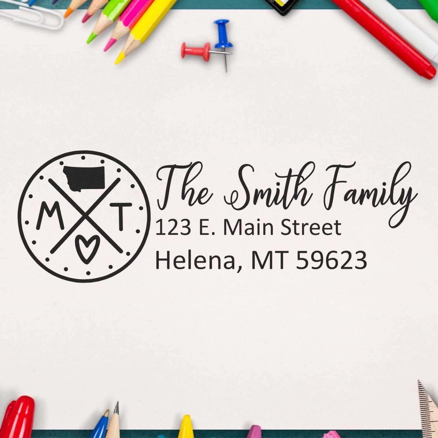 PSI Pre-Inked Montana State Pride Customized Address Stamp featuring a circular design with MT and a heart, personalized with The Smith Family address, surrounded by colorful stationery.