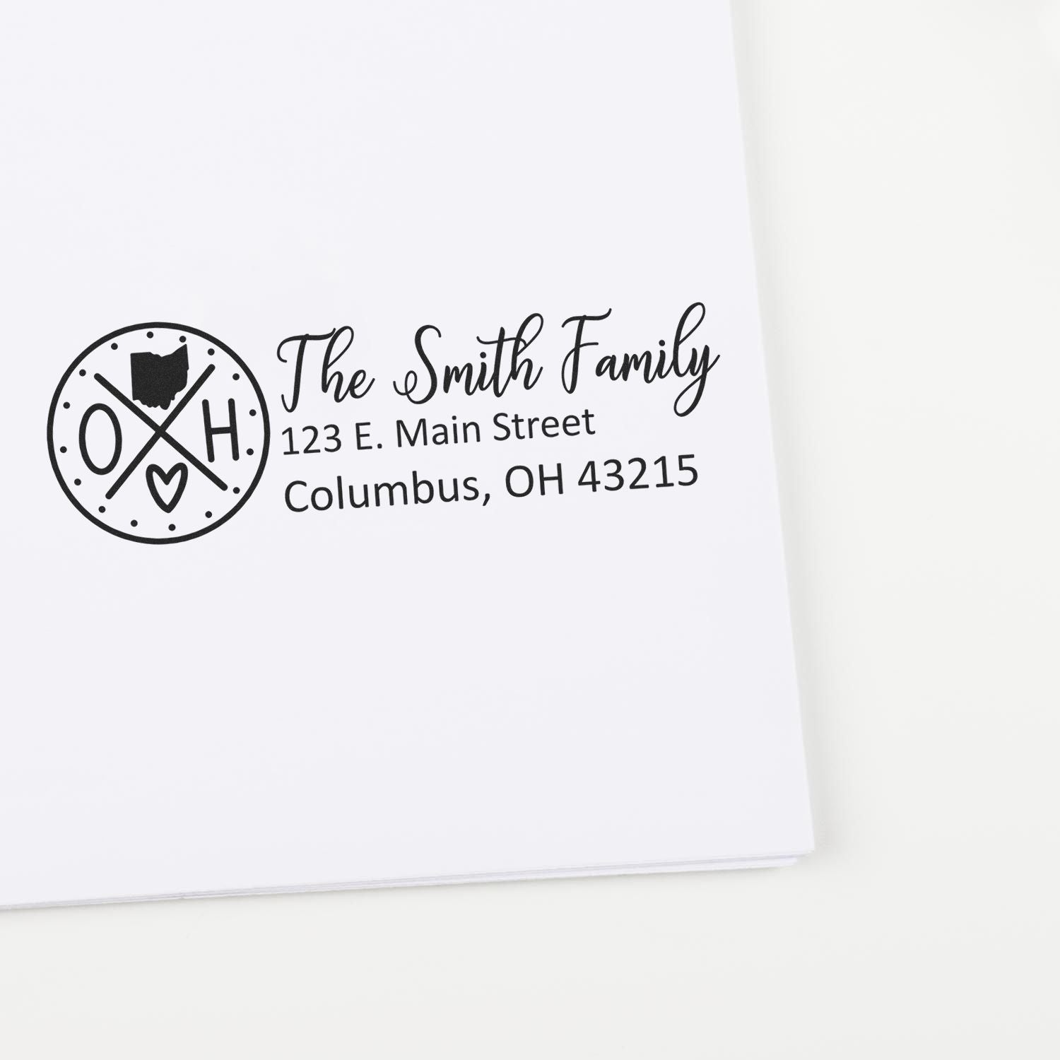 Ohio State Pride Customized Address Stamp on white paper, featuring a circular design with OH and a heart, personalized with The Smith Family and an address in Columbus, OH.