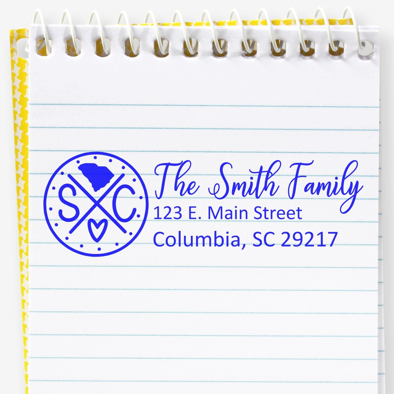 South Carolina State Pride Customized Address Stamp on a notepad, featuring a blue design with state outline, initials, and a heart, personalized with The Smith Family and an address in Columbia, SC.