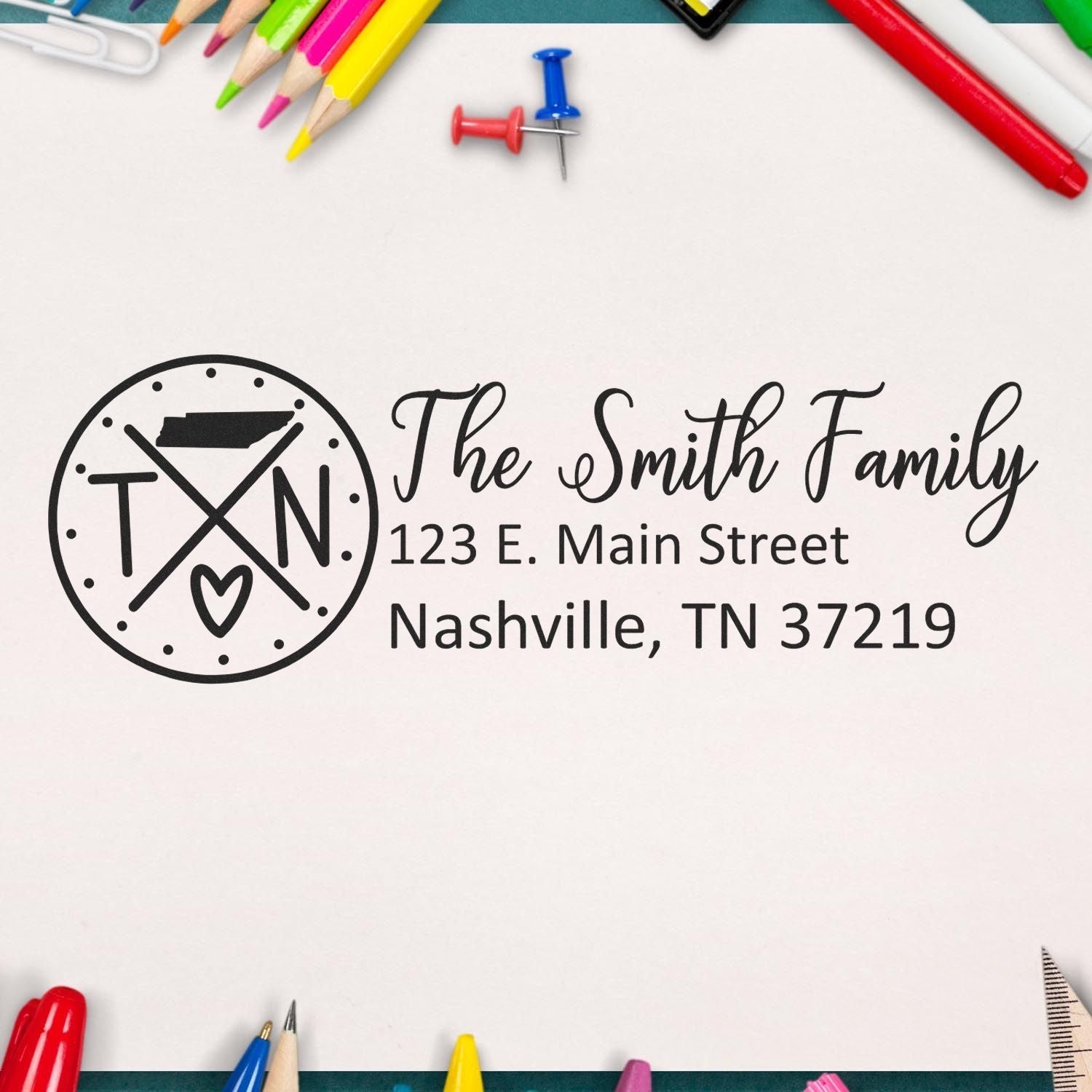 Self-Inking State Love of Tennessee Custom Address Stamp on paper with colorful stationery around, featuring The Smith Family and a Nashville address.