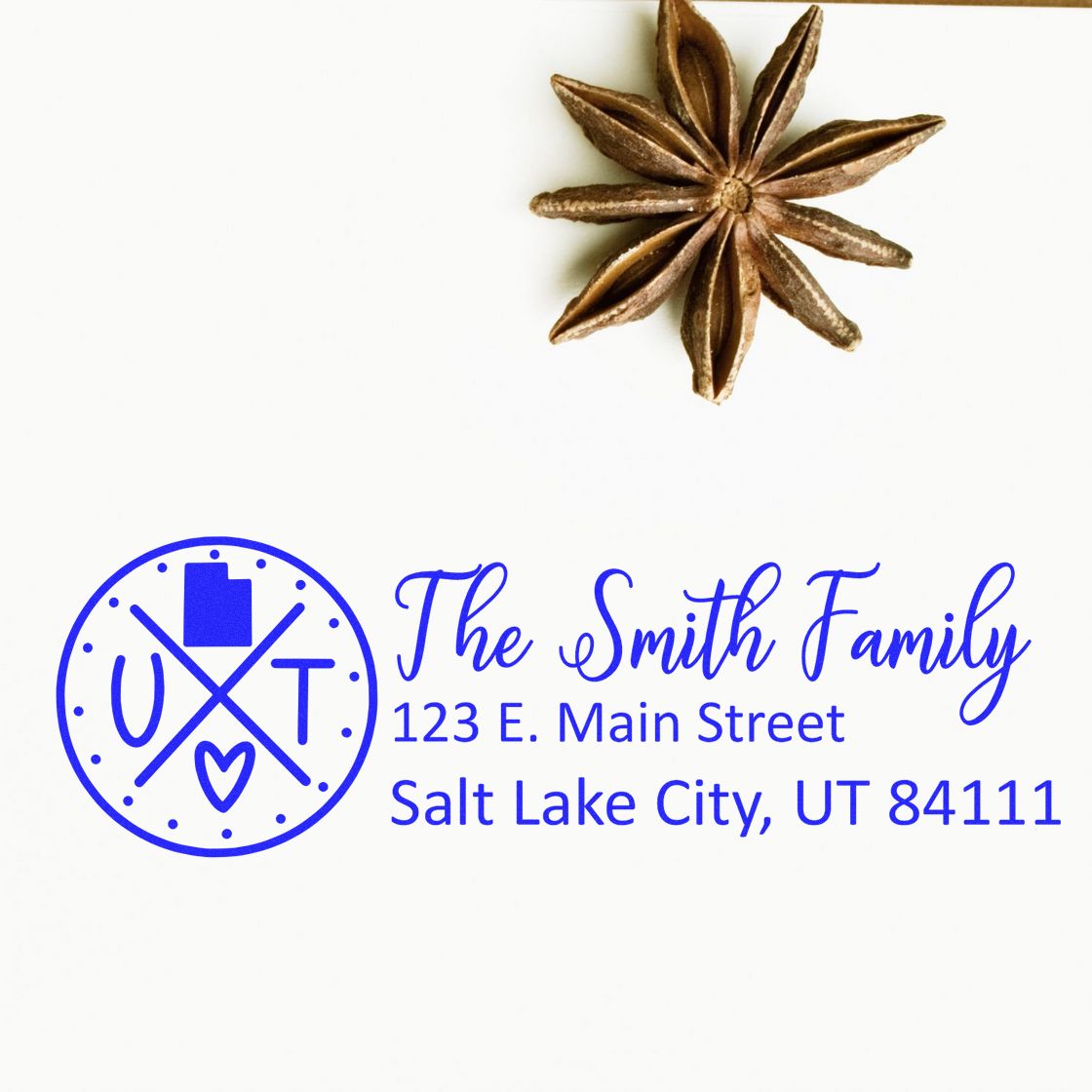 Utah State Pride Customized Address Stamp featuring a circular design with UT and a heart, personalized with The Smith Family and address, next to a star anise on a white background.