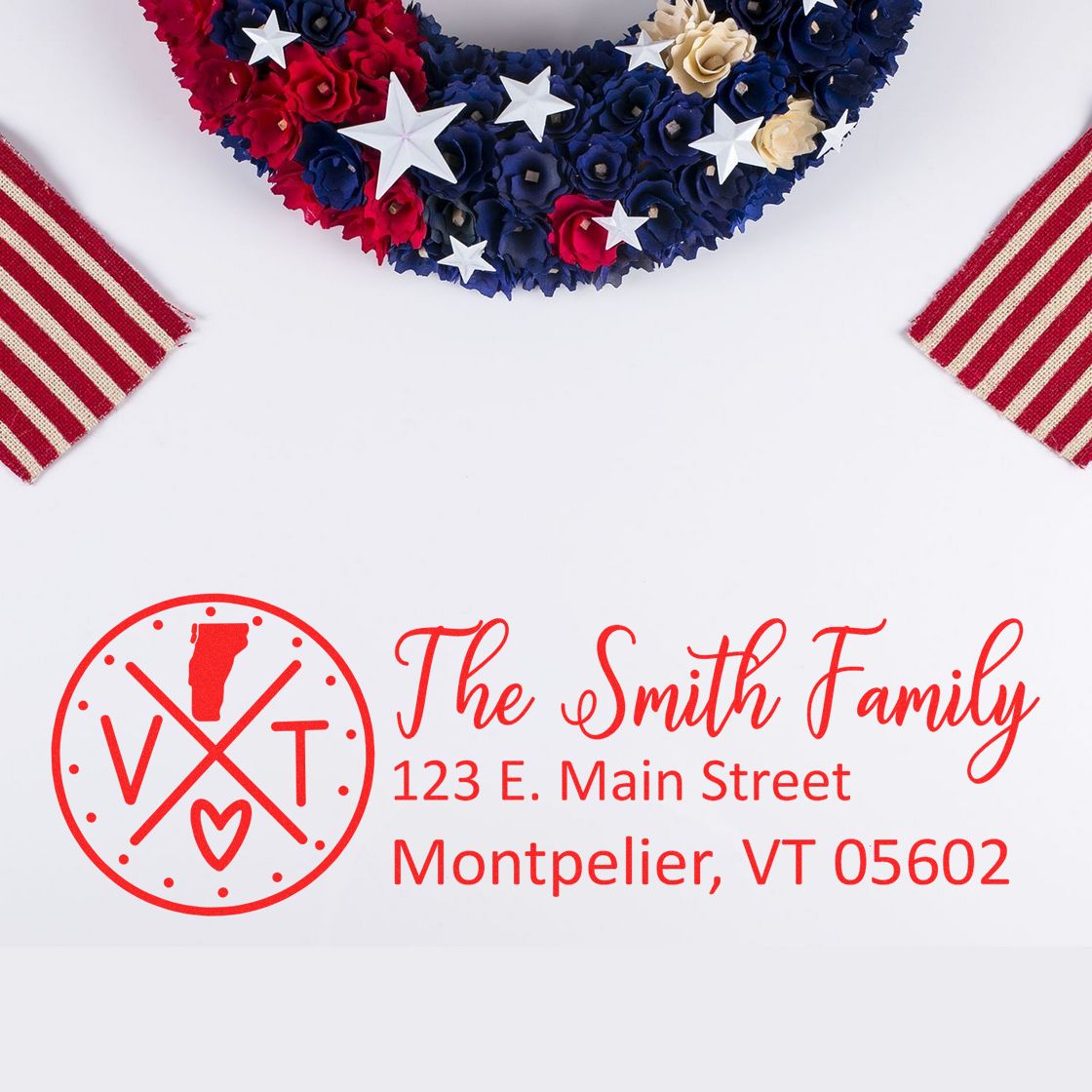 Vermont State Pride Customized Address Stamp featuring a red design with VT and a heart, displayed on a white background with a patriotic wreath and striped fabric accents.