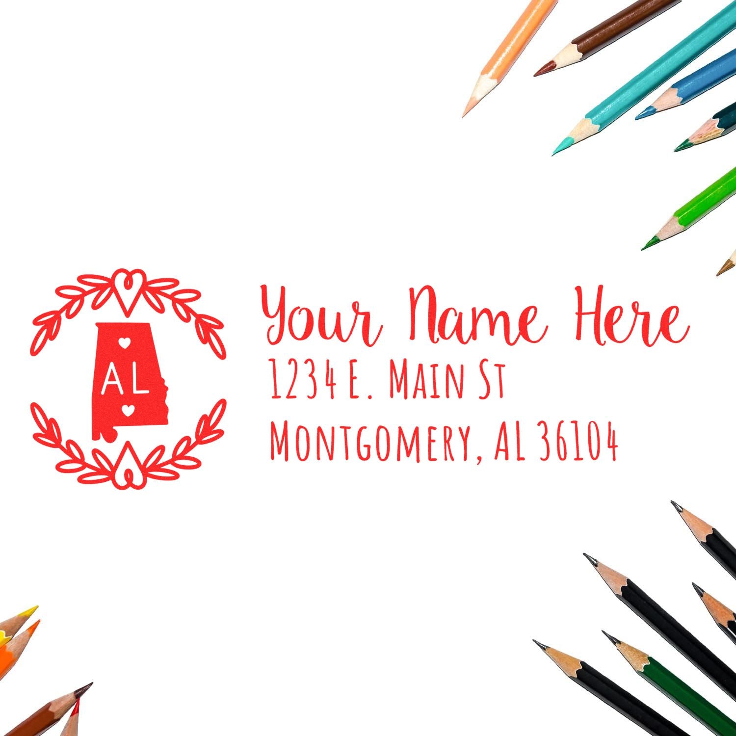 Self-Inking State Wreath of Alabama Address Stamp with a red Alabama outline and heart wreath design, surrounded by colored pencils. Customizable address text in elegant red font.