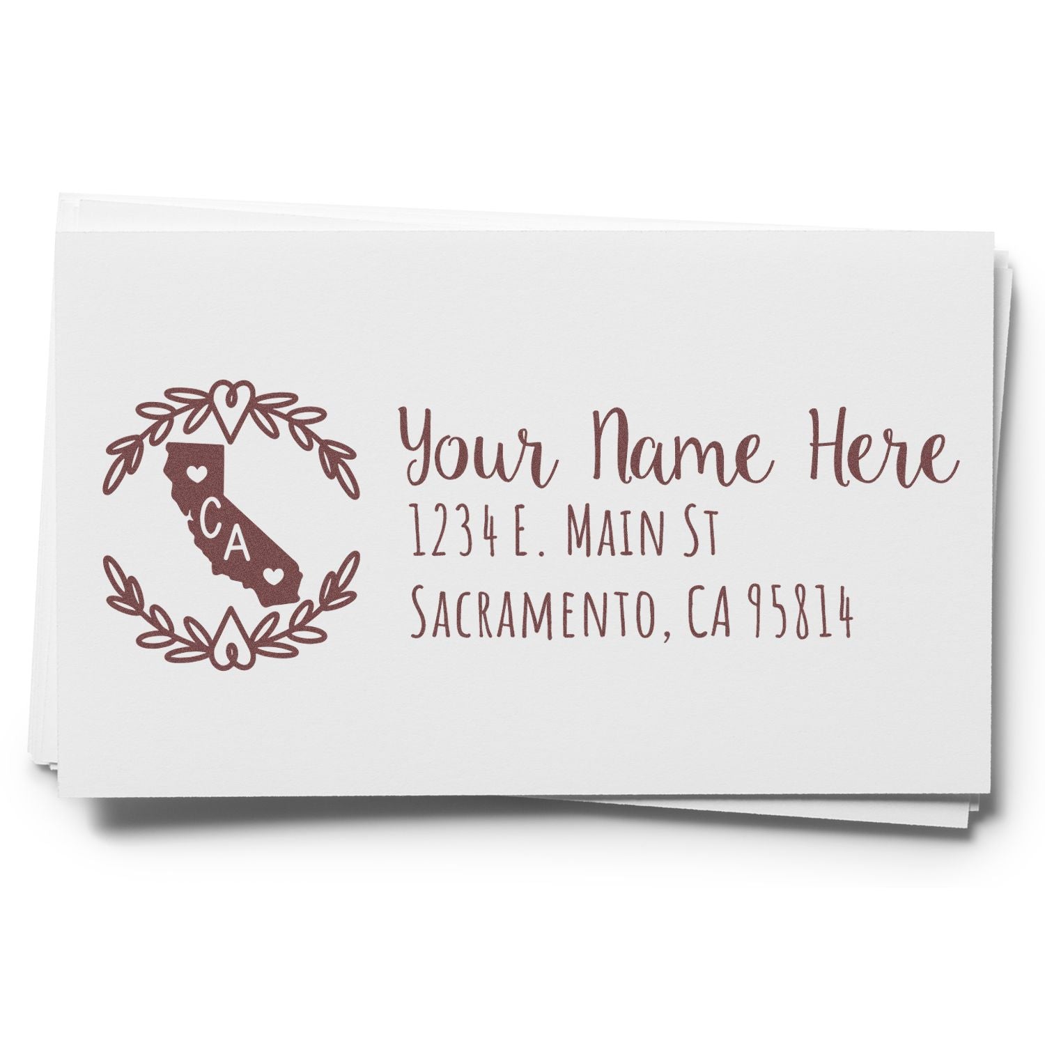 California State Custom Return Address Stamp on white paper, featuring a decorative design with hearts and the state outline. Text includes Your Name Here and a sample address in elegant font.