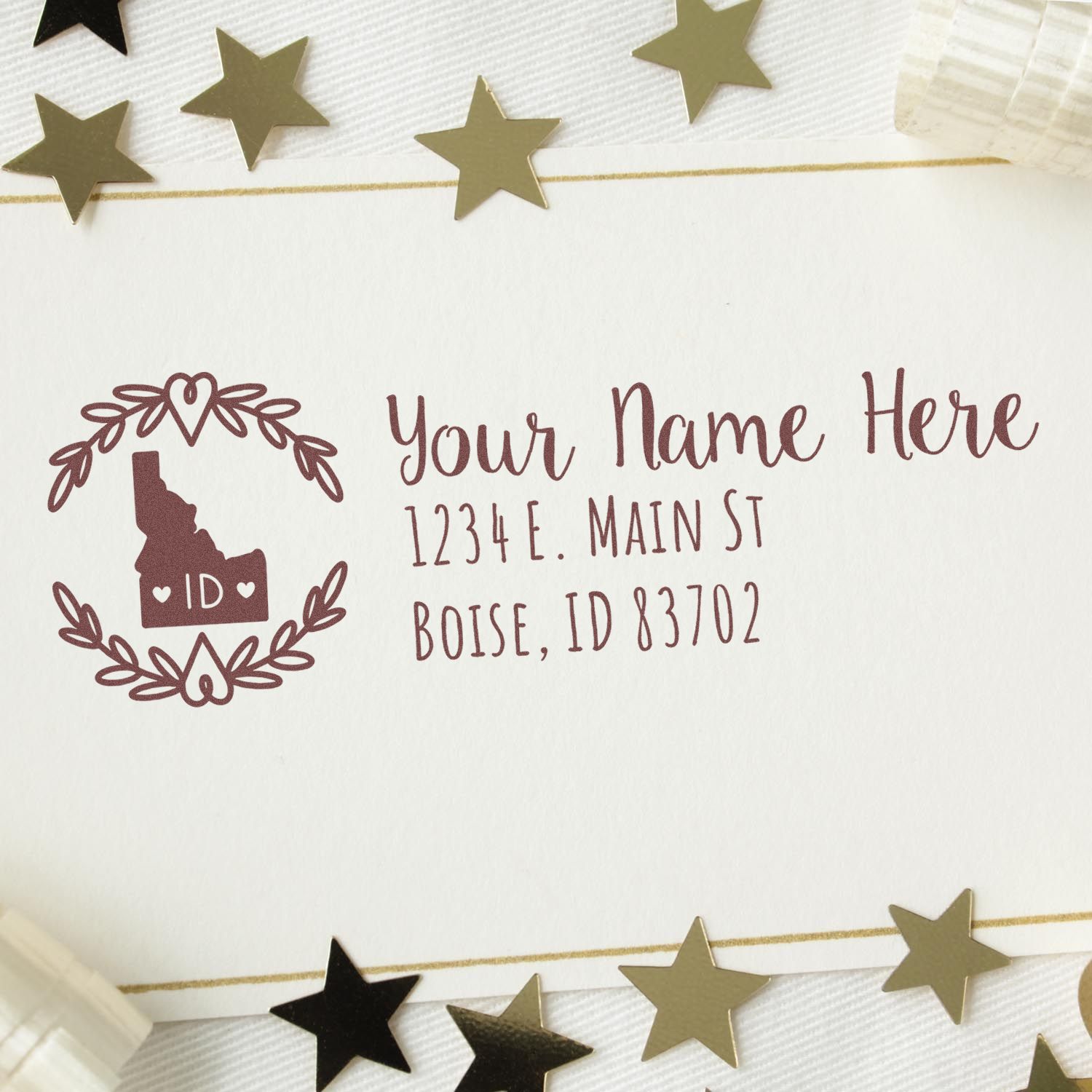 Idaho State Custom Return Address Stamp on a white card with gold stars. Features a heart design and space for name and address, showcasing Boise, ID. Perfect for personalized stationery.