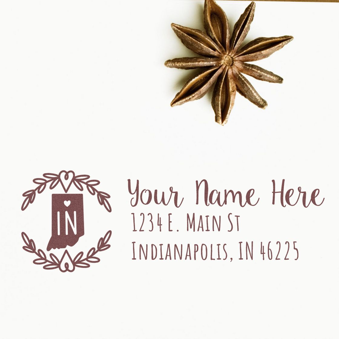 Indiana State Custom Return Address Stamp on white paper with decorative border, featuring a star anise accent. Text includes placeholder name and address in elegant font.