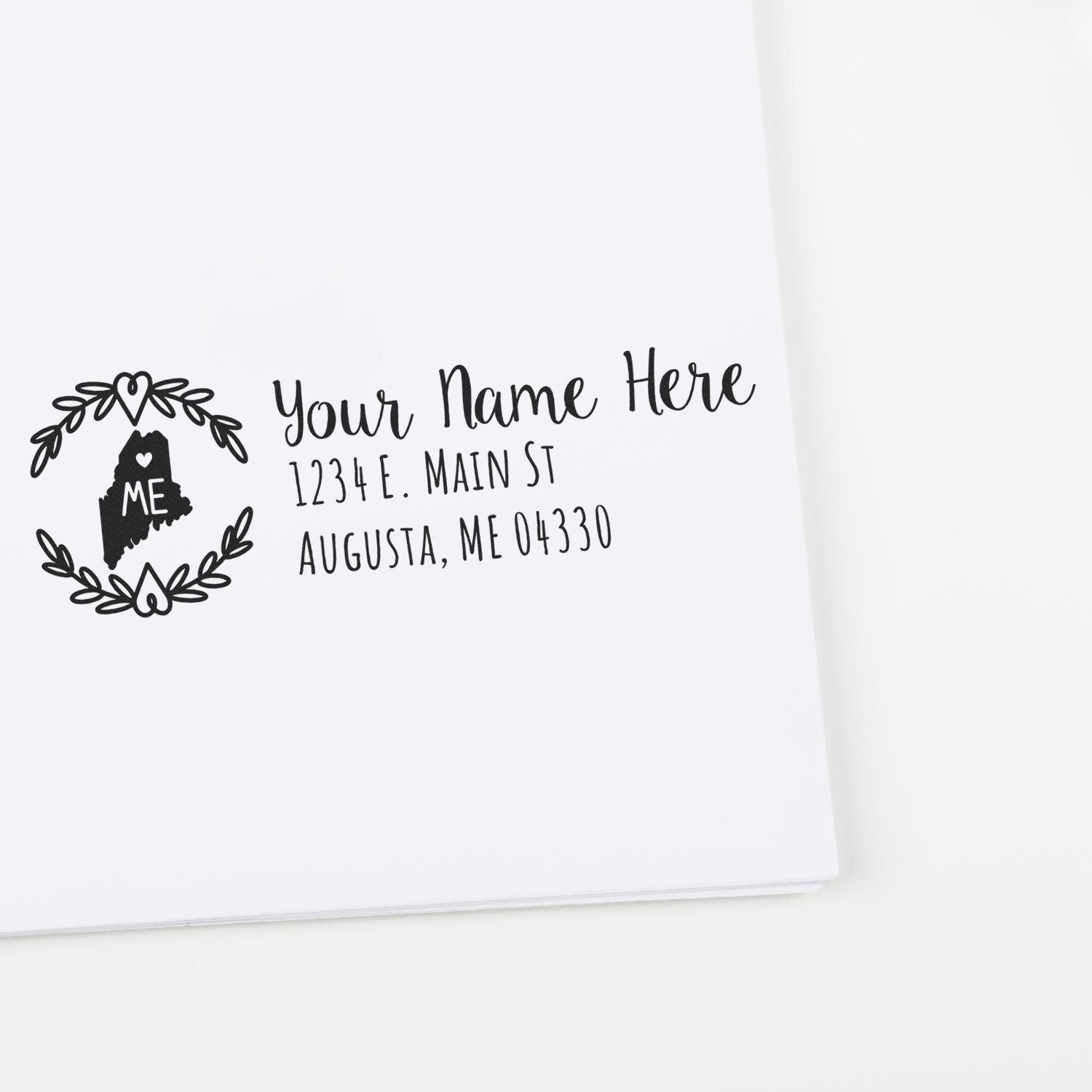 Slim Maine Personalized Pre-Inked Address Stamp on white paper, featuring a decorative Maine state outline with space for custom name and address. Ideal for adding a personal touch to mail.