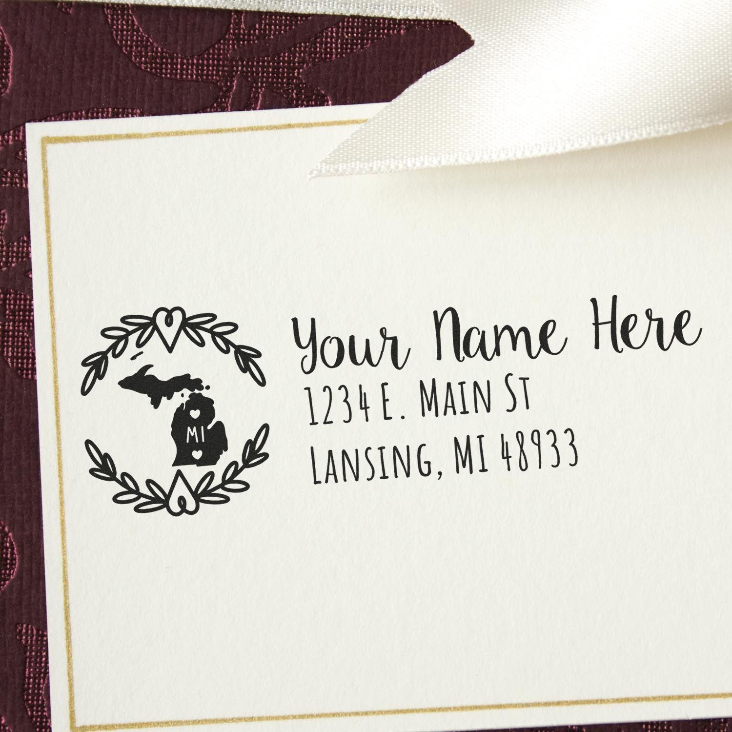 Michigan State Custom Return Address Stamp on a card with a decorative border, featuring a map outline and heart design. Text includes placeholder name and address in elegant font.