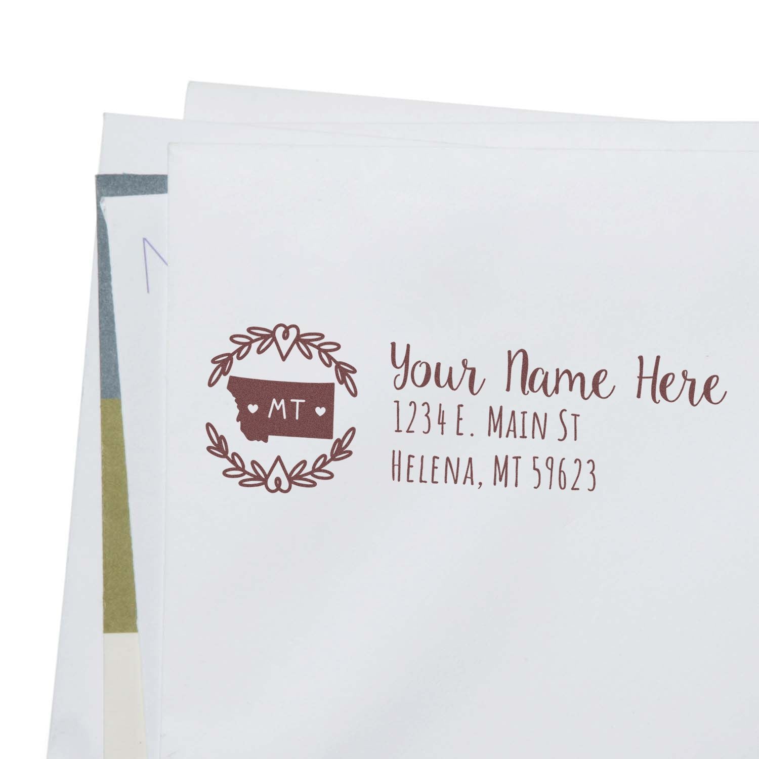 Envelope with a Self-Inking State Wreath of Montana Address Stamp, featuring a decorative wreath and MT design, personalized with name and address in elegant font.