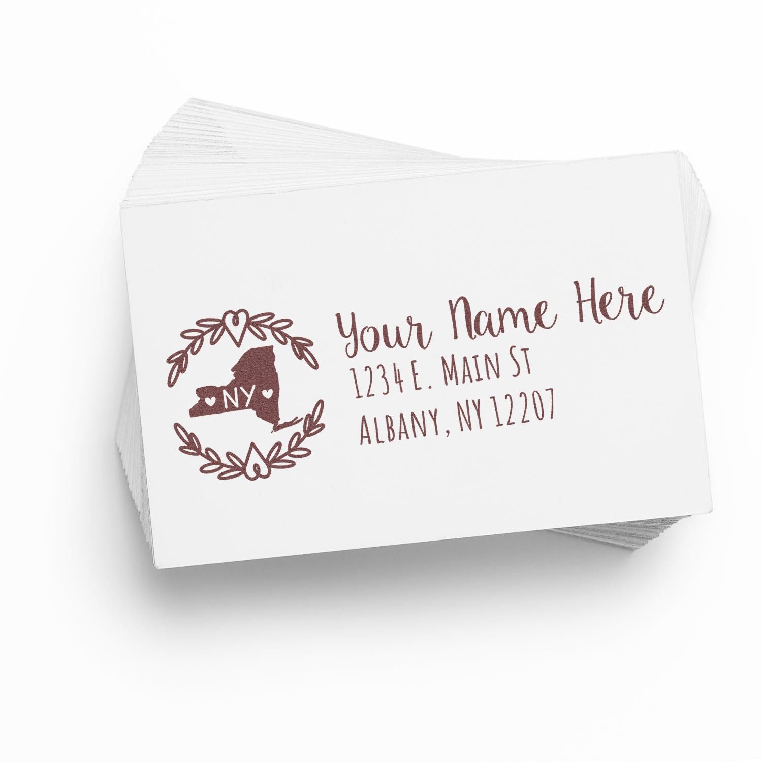 PSI Pre-Inked New York State Customized Address Stamp on white cards, featuring a NY state outline with hearts and laurel design, personalized with name and address in brown ink.