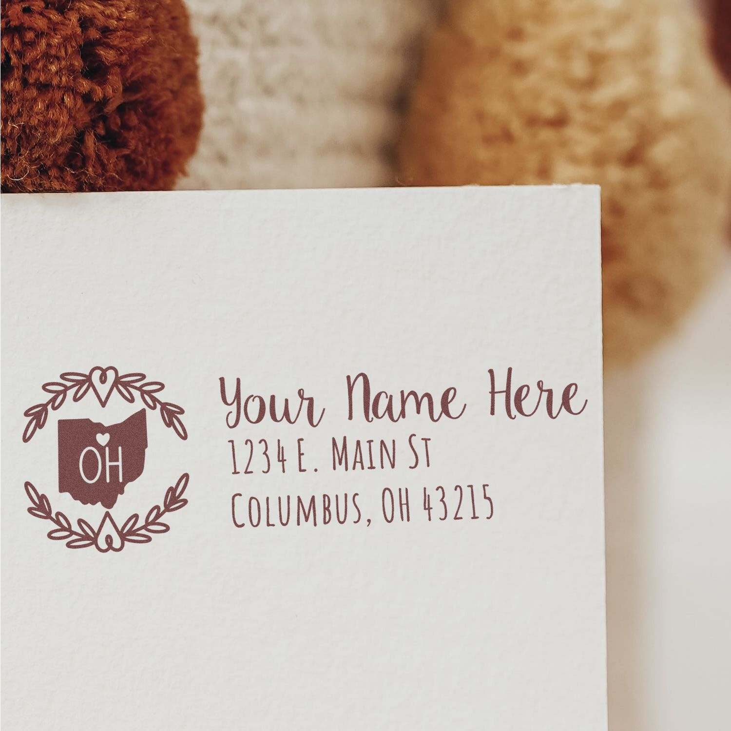 Ohio State Custom Return Address Stamp on an envelope, featuring a heart and OH design, with placeholder text for name and address in Columbus, OH.