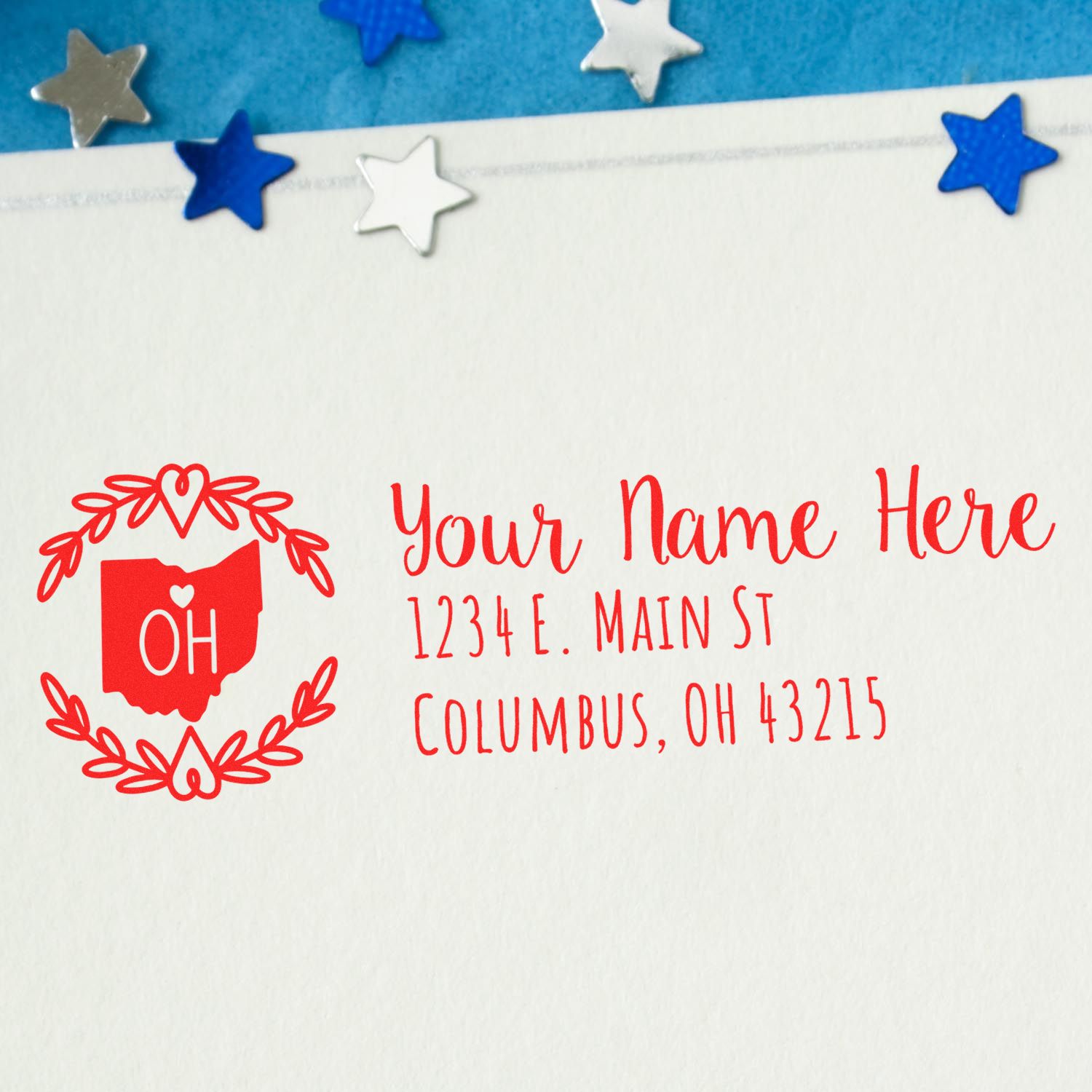 Ohio State Custom Return Address Stamp on an envelope, featuring a red Ohio outline with OH inside, surrounded by a heart design. Address reads: 1234 E. Main St, Columbus, OH 43215.